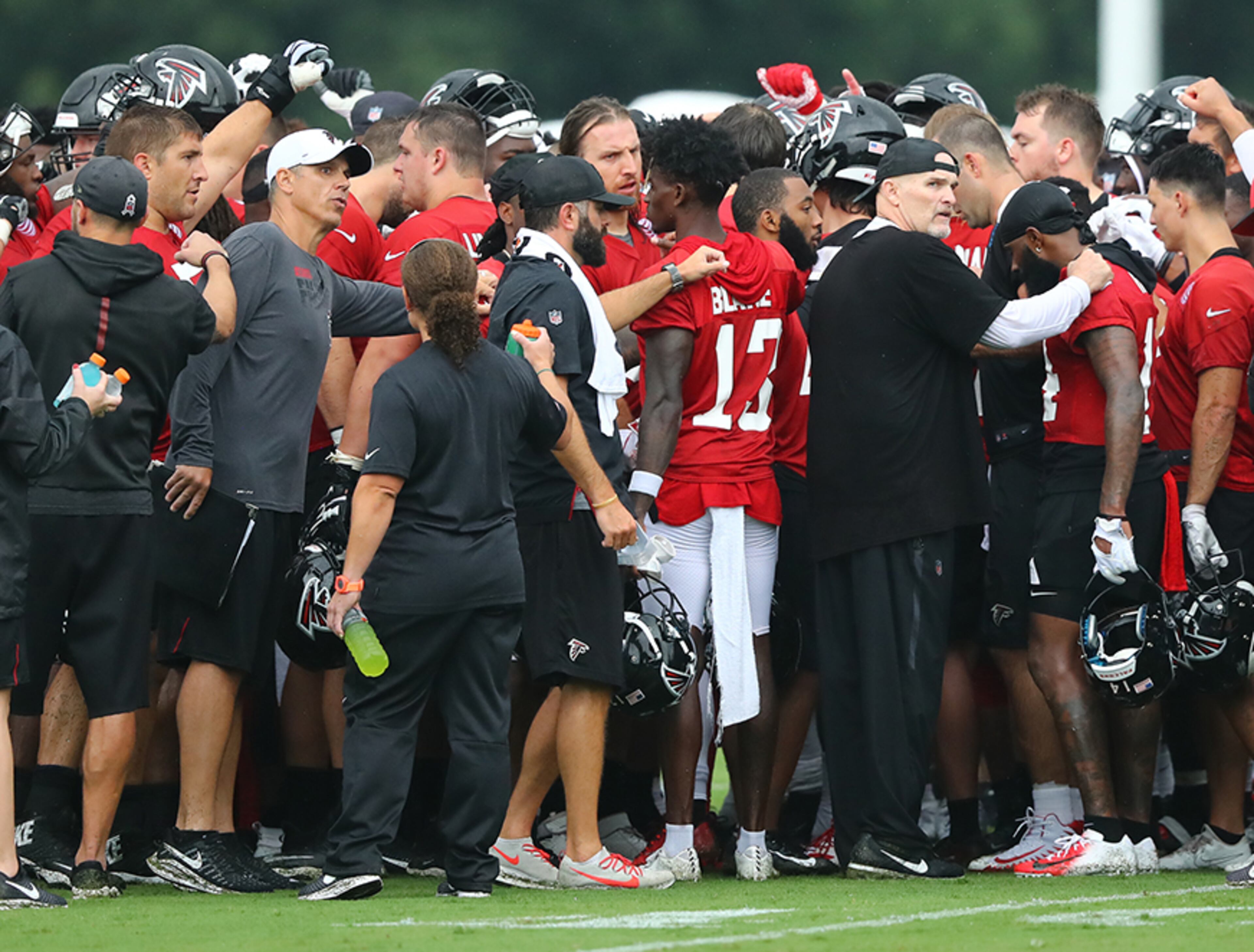 Falcons head coach Dan Quinn has the team huddle up during the second practice of training camp Tuesday, July 23, 2019, in Flowery Branch.