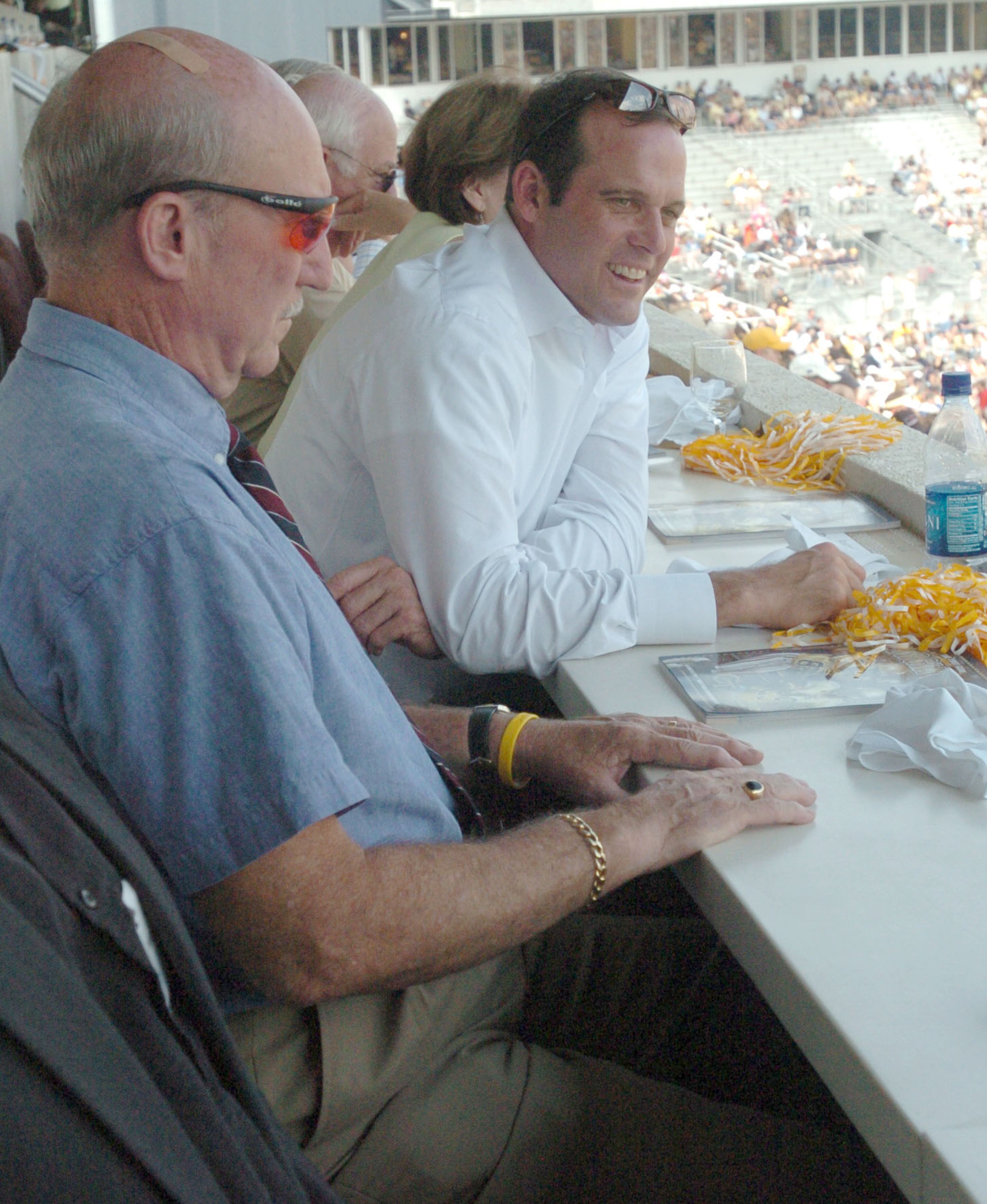 060916 - Atlanta, GA -- John Dewberry (RT/YOUNGER), atlanta developer and a former Ga Tech QB. He is in the president's box at the Bobby Dodd Stadium with his dad Gary Dewberry (LFT) during a game against Troy. Sept 16, 2006 (Renee' Hannans Henry / AJC Staff).
