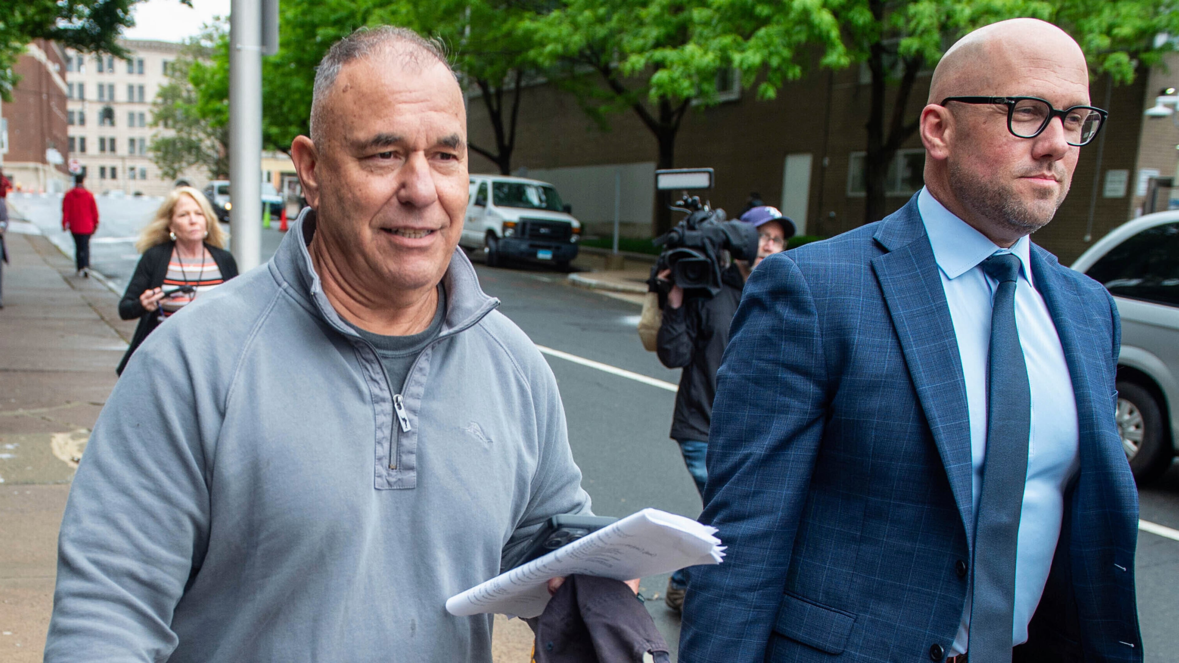 FILE - Former Connecticut deputy budget director Konstantinos "Kosta" Diamantis, left, accompanied by his lawyer Vincent Provenzano, right, walks out of federal court on May 16, 2024, in Hartford, Conn. (Aaron Flaum/Hartford Courant via AP, File)