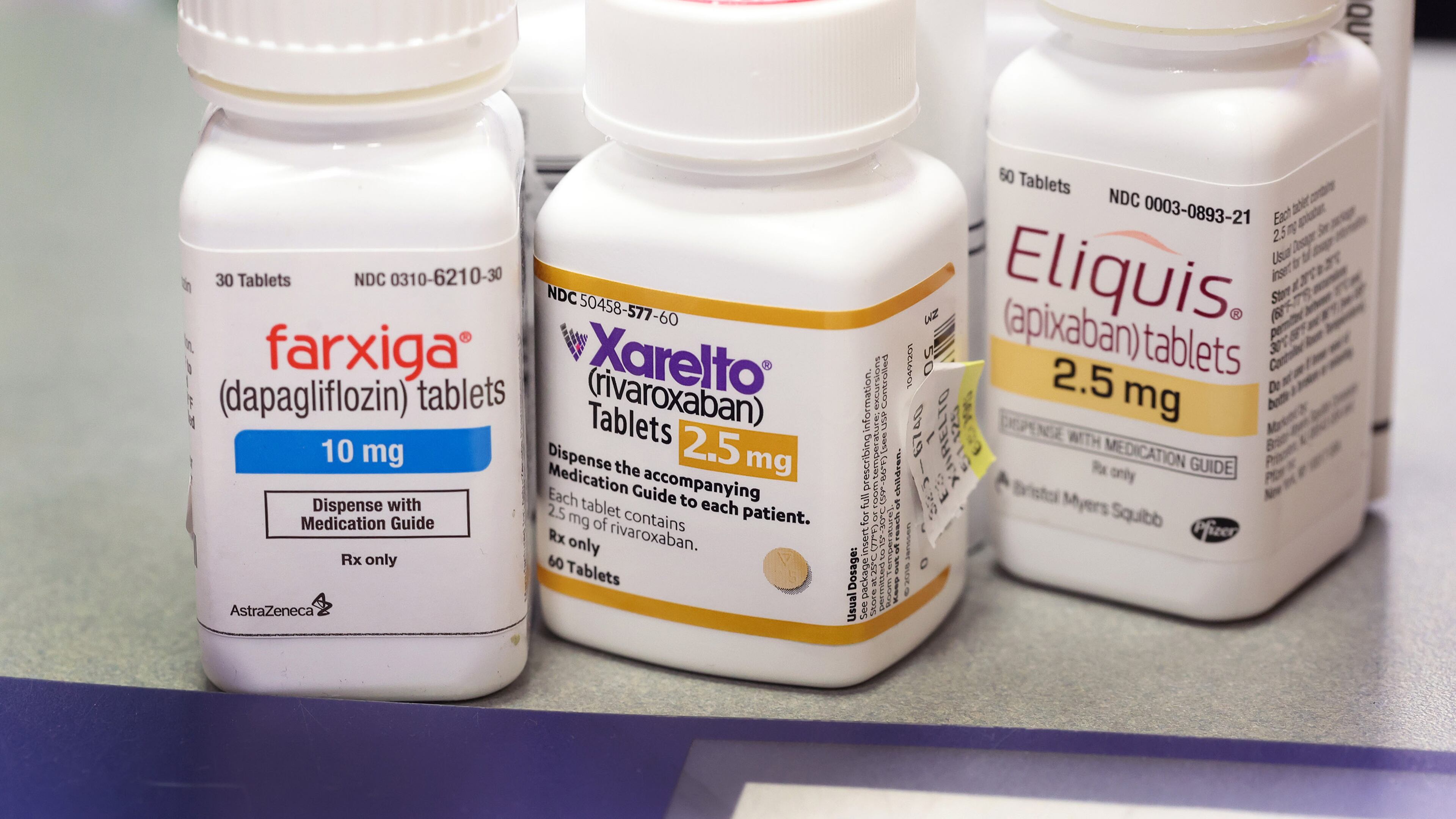 Farxiga, Xarelto, and Eliquis at the New City Halsted Pharmacy on Aug. 29 in Chicago. These are three of 10 prescription drugs that will be subject to Medicare price negotiations under the Inflation Reduction Act. (Photo Illustration by Scott Olson/Getty Images/TNS)