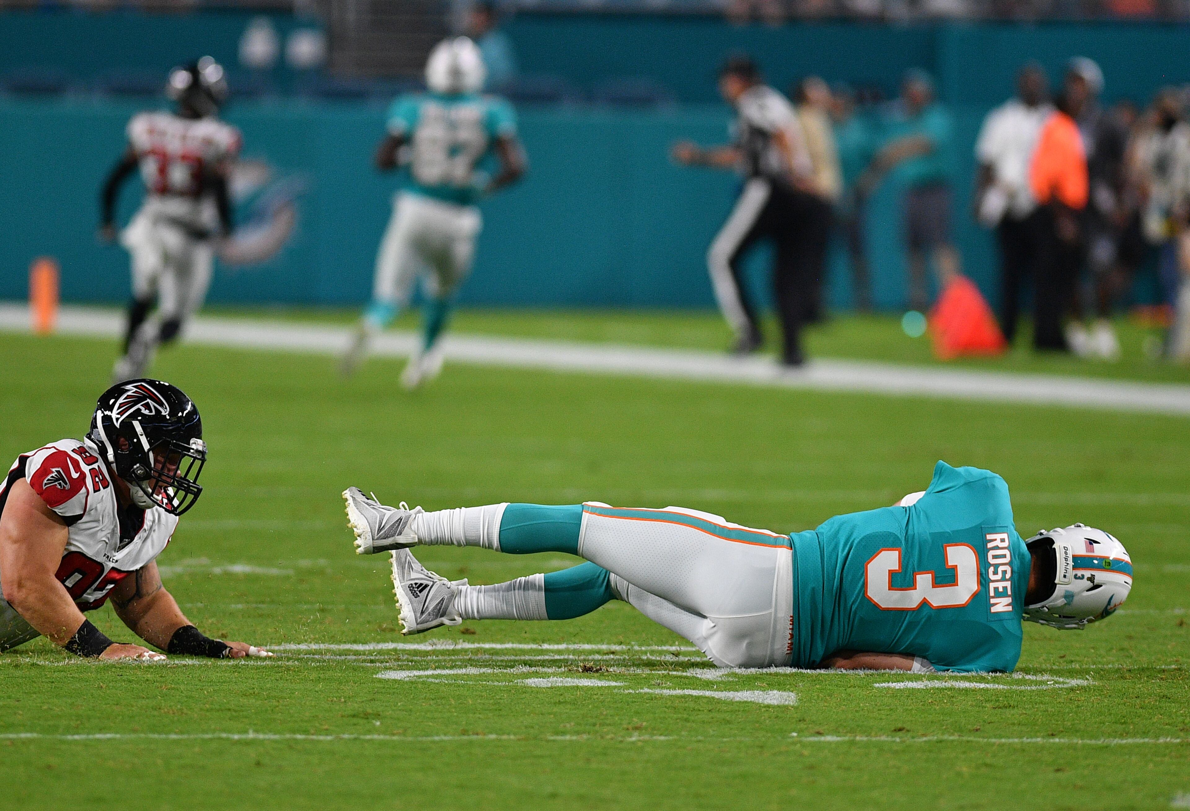 Josh Rosen #3 of the Miami Dolphins tackled in the second quarter during a preseason game against the Atlanta Falcons at Hard Rock Stadium on August 8, 2019 in Miami, Florida. (Photo by Mark Brown/Getty Images)
