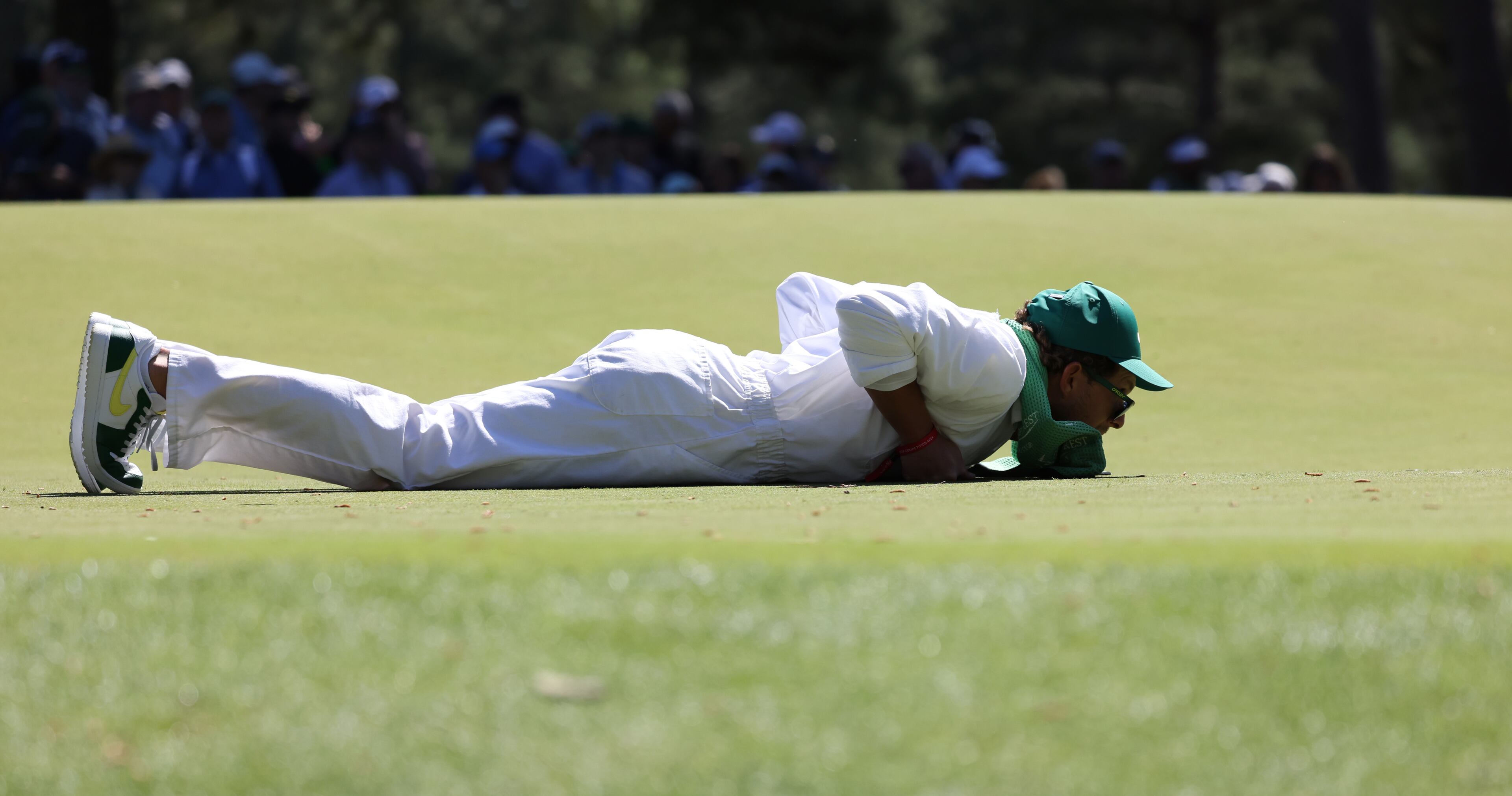 Patrick Reed’s caddie Kessler Karain reads the sixth green during second round of the 2024 Masters Tournament at Augusta National Golf Club, Friday, April 12, 2024, in Augusta, Ga. Jason Getz / Jason.Getz@ajc.com)