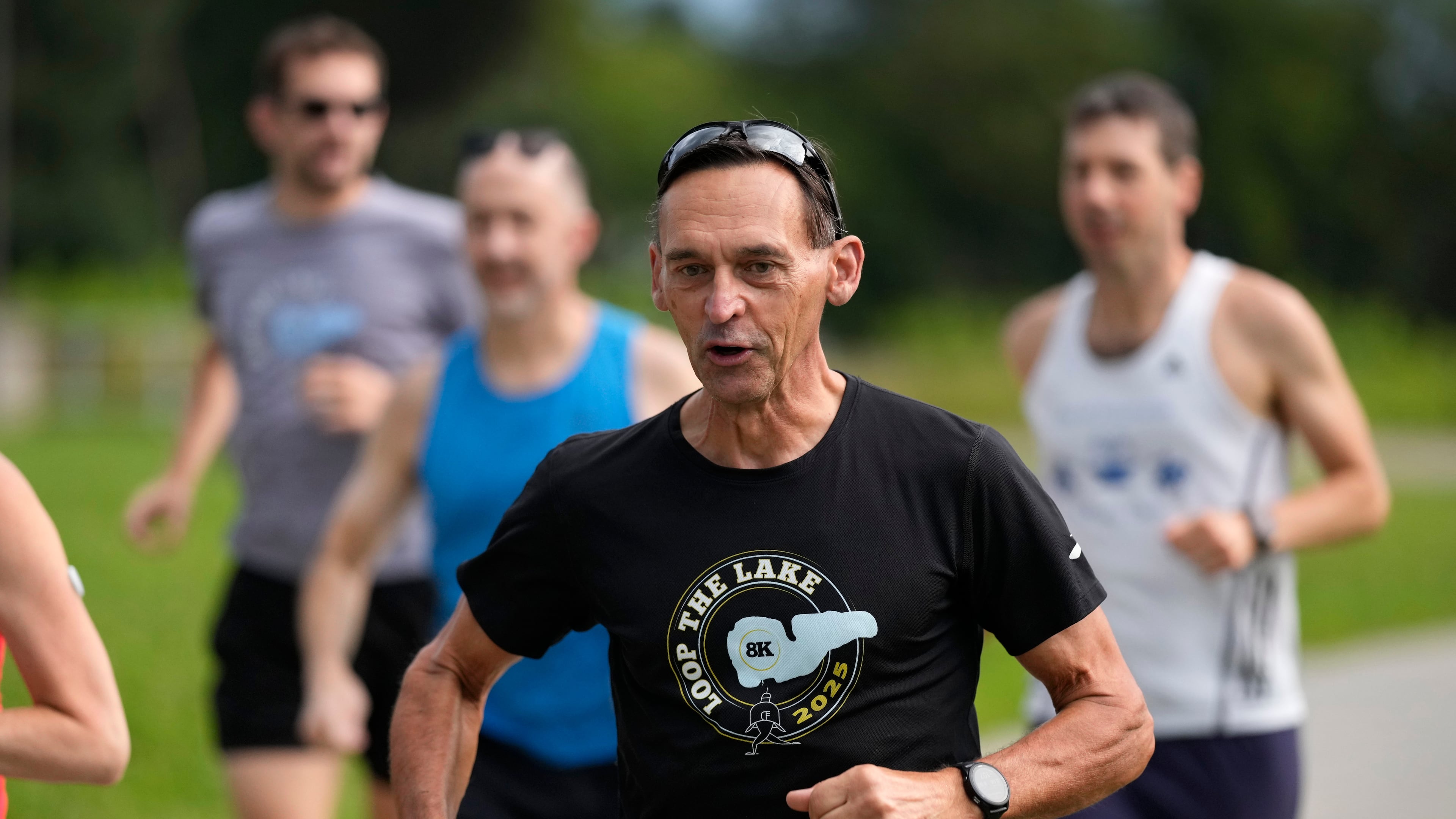 Paul Grinvalds, of West Des Moines, Iowa, runs with the Raccoon River Running Club, Sunday, Aug. 9, 2026, in West Des Moines, Iowa. (AP Photo/Charlie Neibergall)