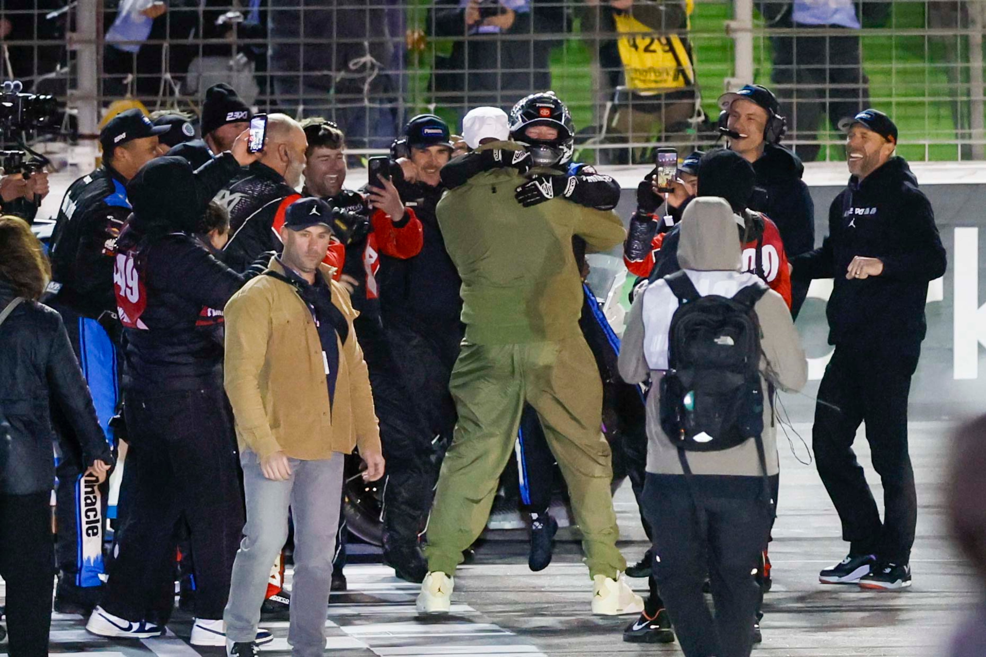 23XI Racing driver Tyler Reddick (45) celebrates with his team’s co-owner, Michael Jordan, after winning the NASCAR Autotrader 400 at EchoPark Speedway on Sunday, Feb. 22, 2026, in Hampton, Ga. This marks Reddick’s second consecutive win. (Miguel Martinez/AJC)