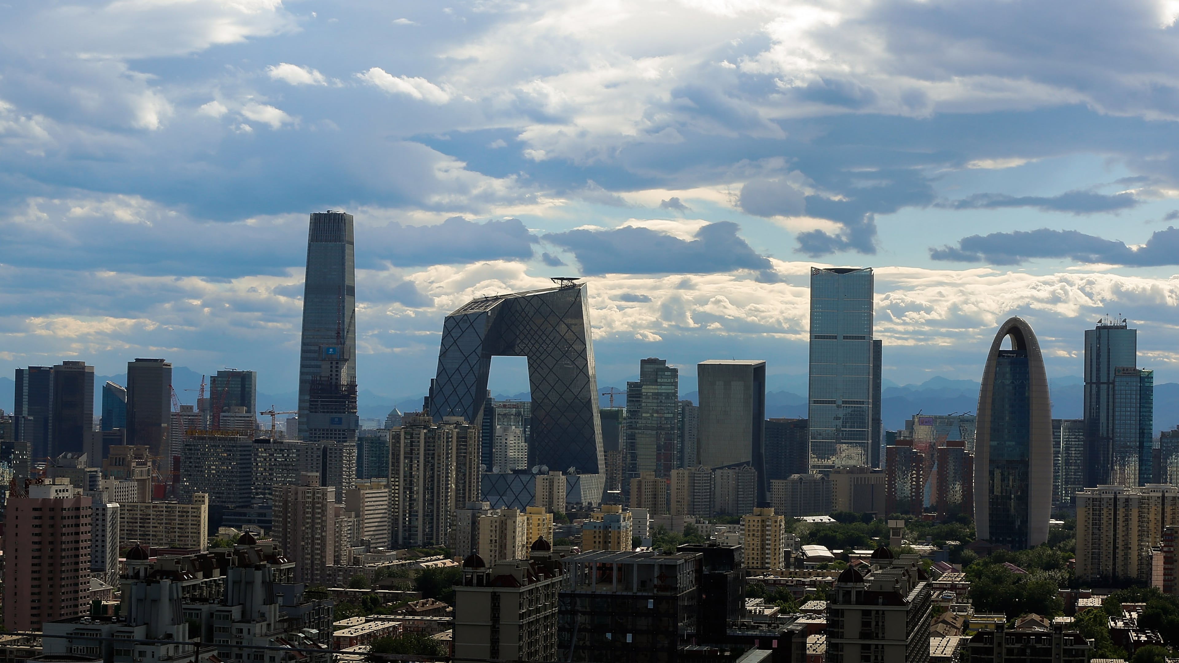 BEIJING, CHINA - JUNE 12: A general view shows the headquarter of China Central Television amid the Beijing skyline at central business district on June 12, 2015 in Beijing, China. (Photo by Lintao Zhang/Getty Images)