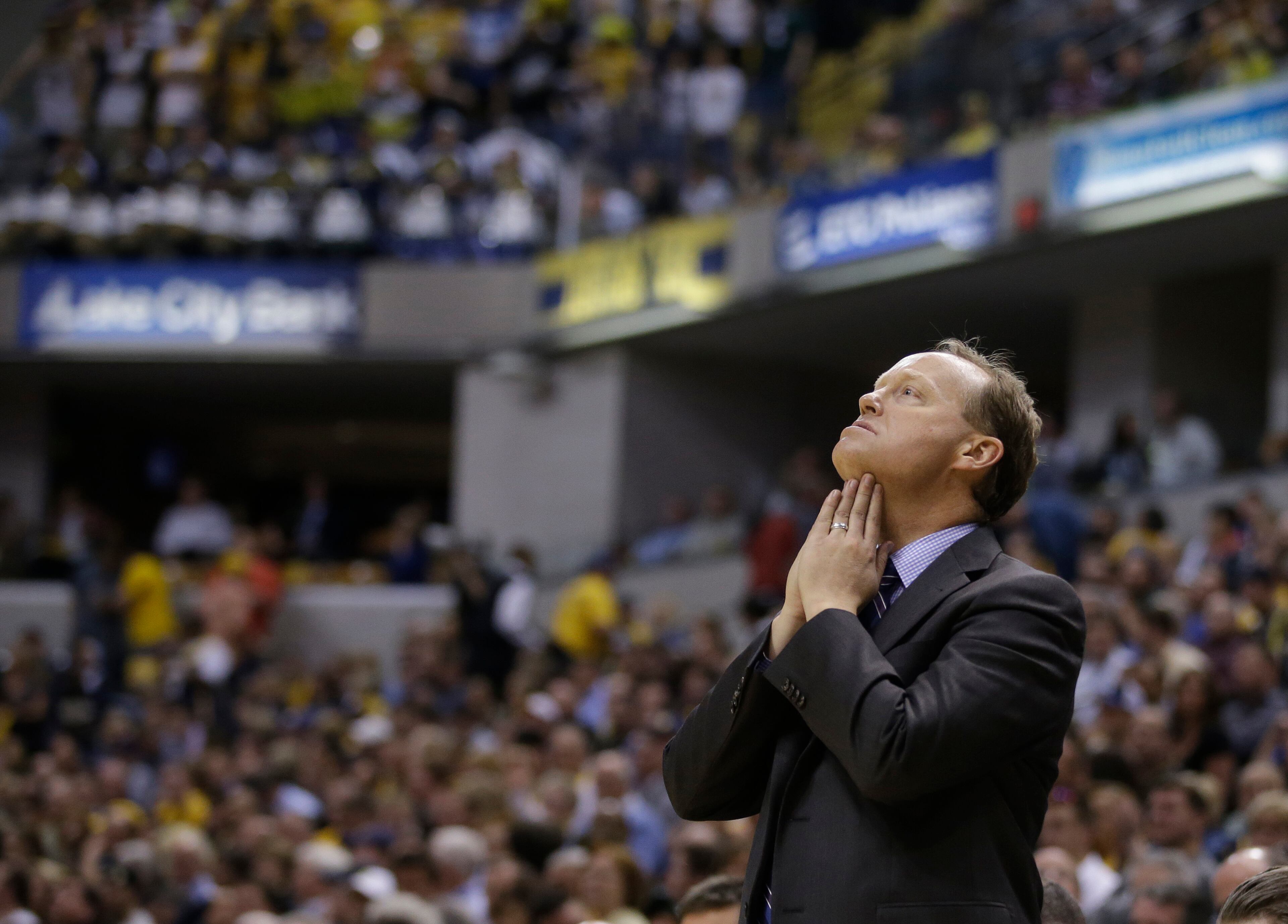 Atlanta Hawks head coach Mike Budenholzer looks up at the scoreboard during the second half in Game 2 of an opening-round NBA basketball playoff series against the Indiana Pacers Tuesday, April 22, 2014, in Indianapolis. Indiana defeated Atlanta 101-85. (AP Photo/Darron Cummings)