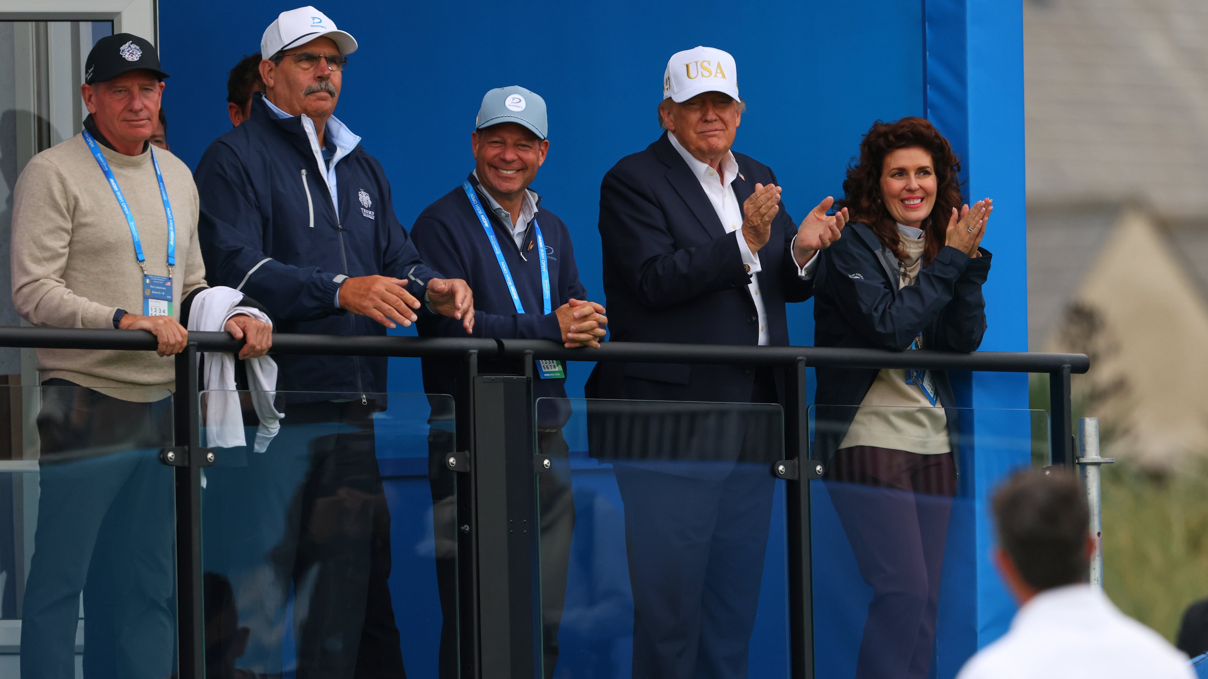 U.S. President Donald Trump applauds to golfer Rory McIlroy of Northern Ireland during the Irish Open at the Trump International Golf Links course in Doonbeg, Ireland, Saturday, Sept. 12, 2026.(AP Photo/Peter Morrison)