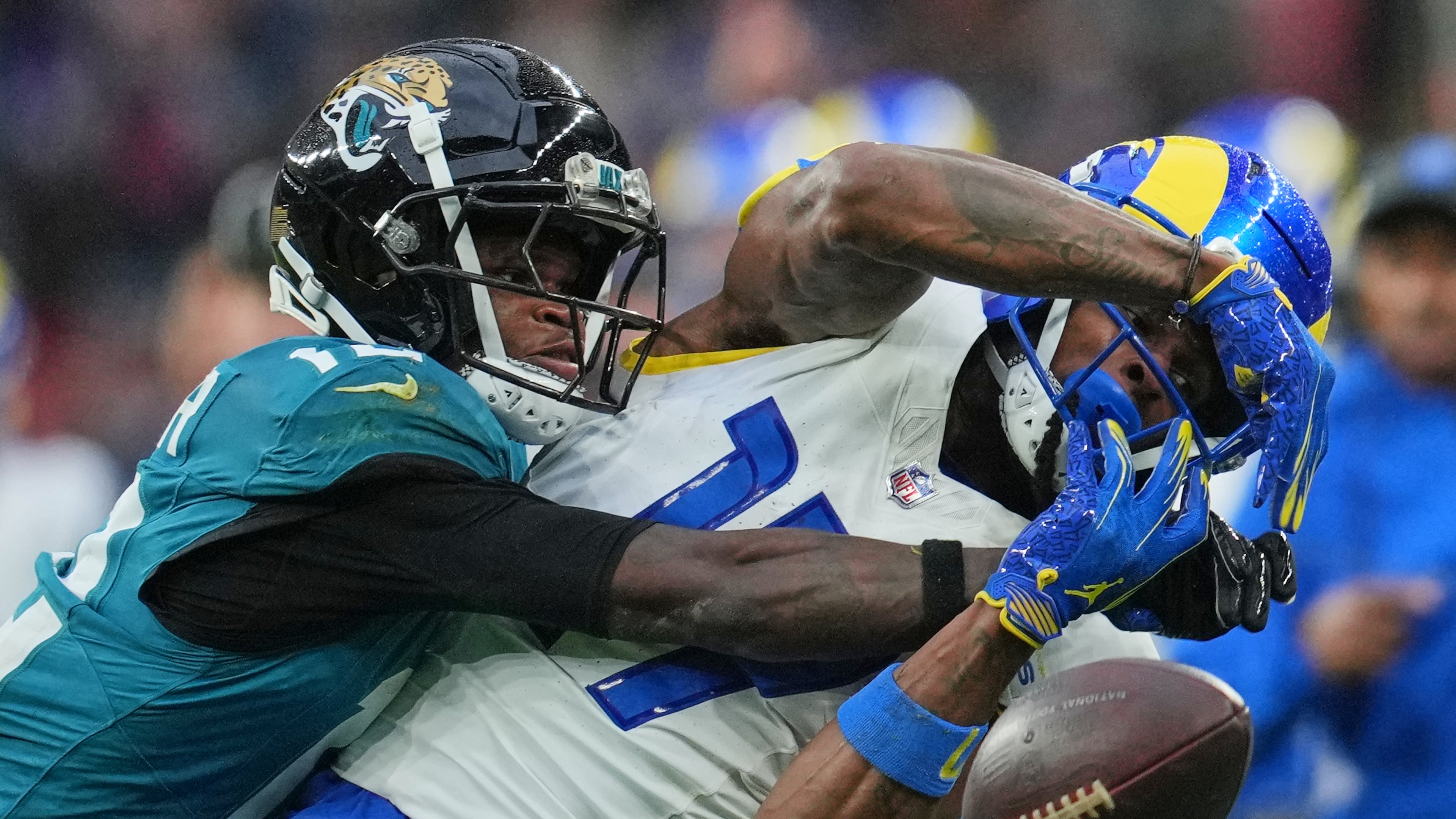 FILE - Los Angeles Rams wide receiver Davante Adams (17) is challenged by Jacksonville Jaguars wide receiver Travis Hunter (12) during the second half of an NFL football game between the Los Angeles Rams and the Jacksonville Jaguars in London, Sunday, Oct. 19, 2025. (AP Photo/Kin Cheung, File)
