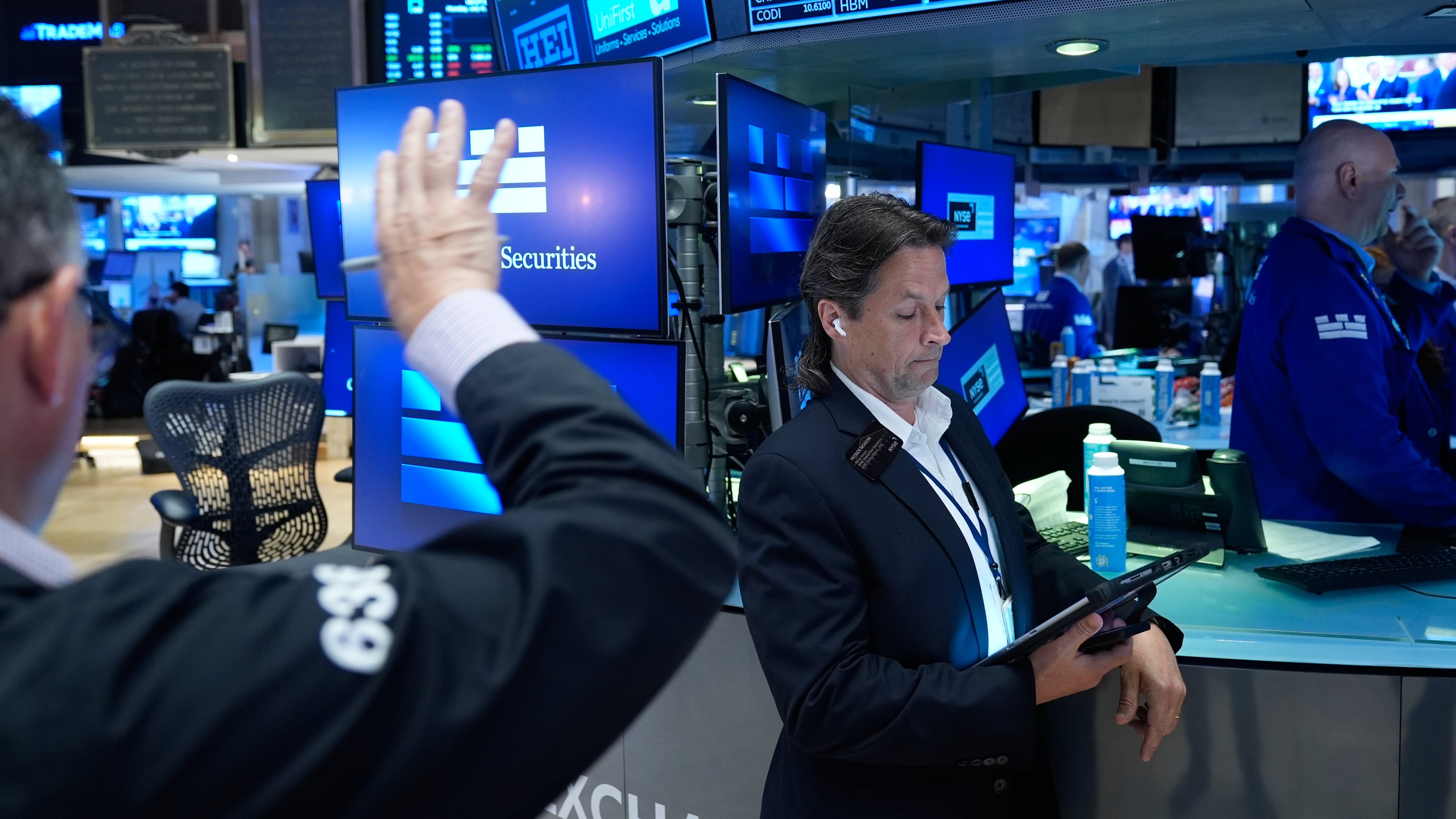 Patrick McKeon works on the floor at the New York Stock Exchange in New York, Monday, July 6, 2026. (AP Photo/Seth Wenig)