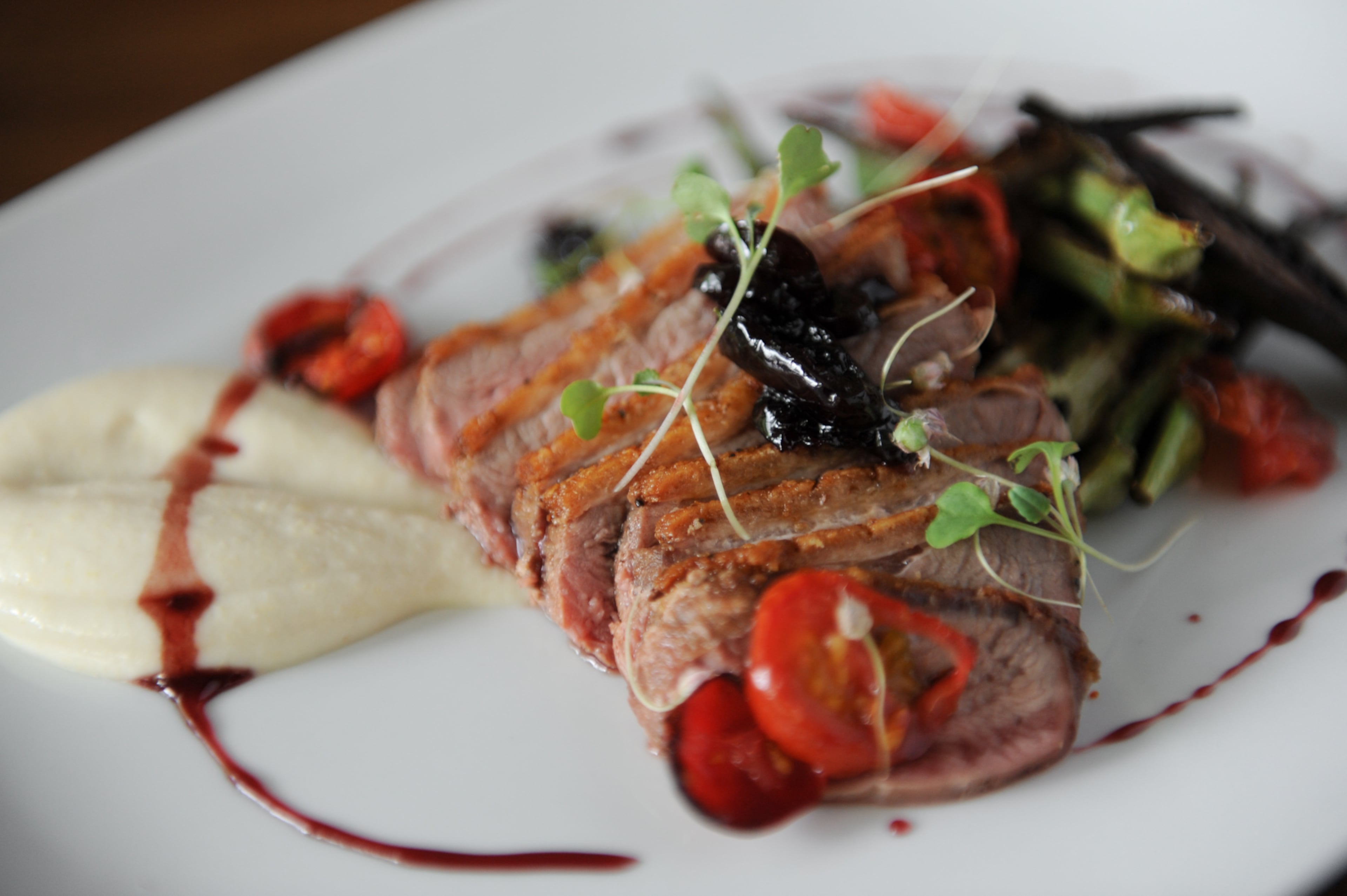 "This duck dish was all-around yumstown, with an umami hit of beech mushrooms and a sweet-tart balance to the cherry sauce, so it played well with others. That cornbread puree was a delicious backdrop, and it did a brilliant job of bridging Southern and German flavors. We need more of this kind of cooking in Atlanta."