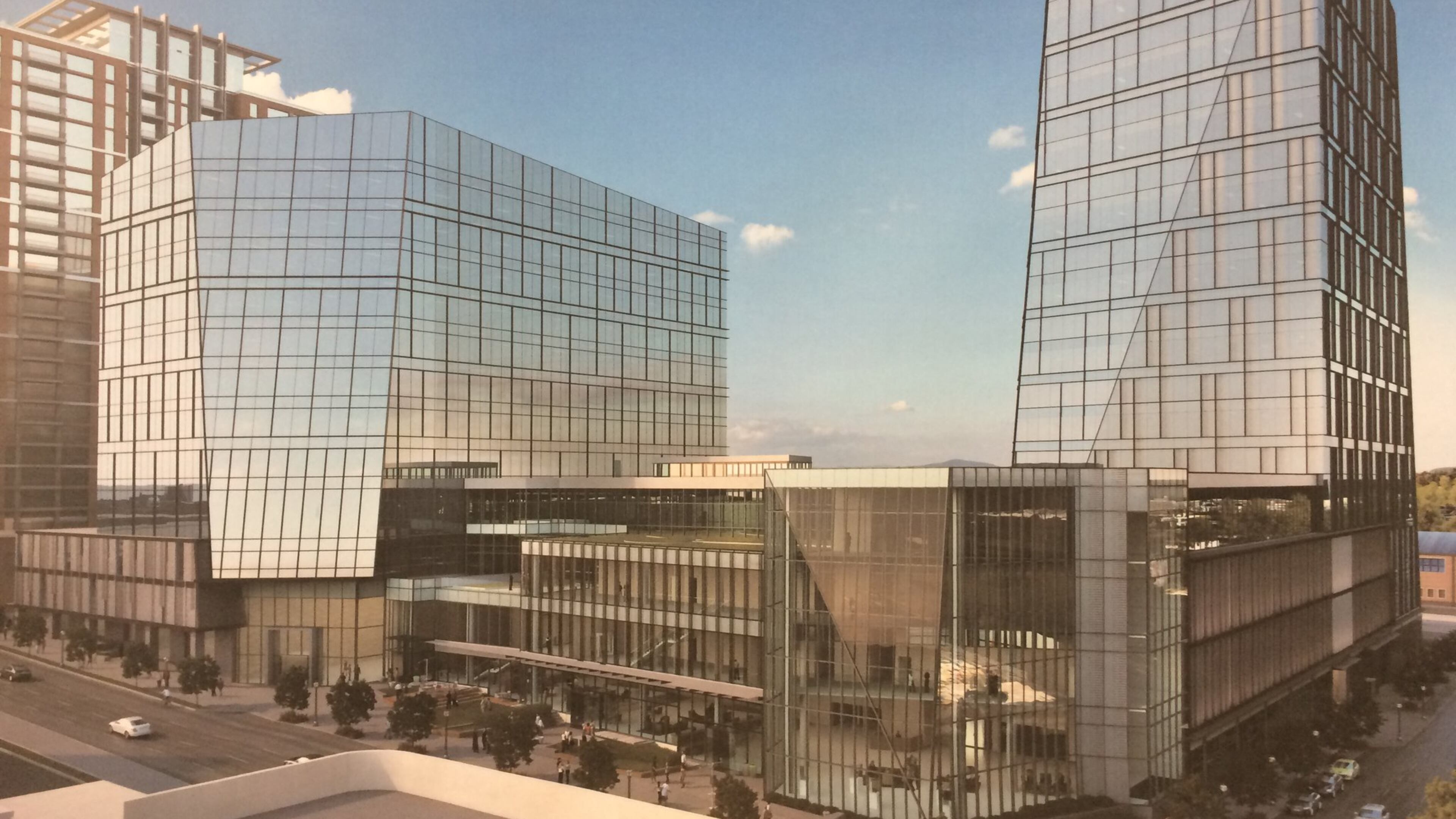 This rendering shows the two phases of Spring and 8th Street, the headquarters campus of NCR. The first tower, a 20-story office building to the right, is under construction. The smaller tower to the left is being designed. Source: Cousins Properties, NCR, Duda Paine Architects, HKS and Kimley-Horn