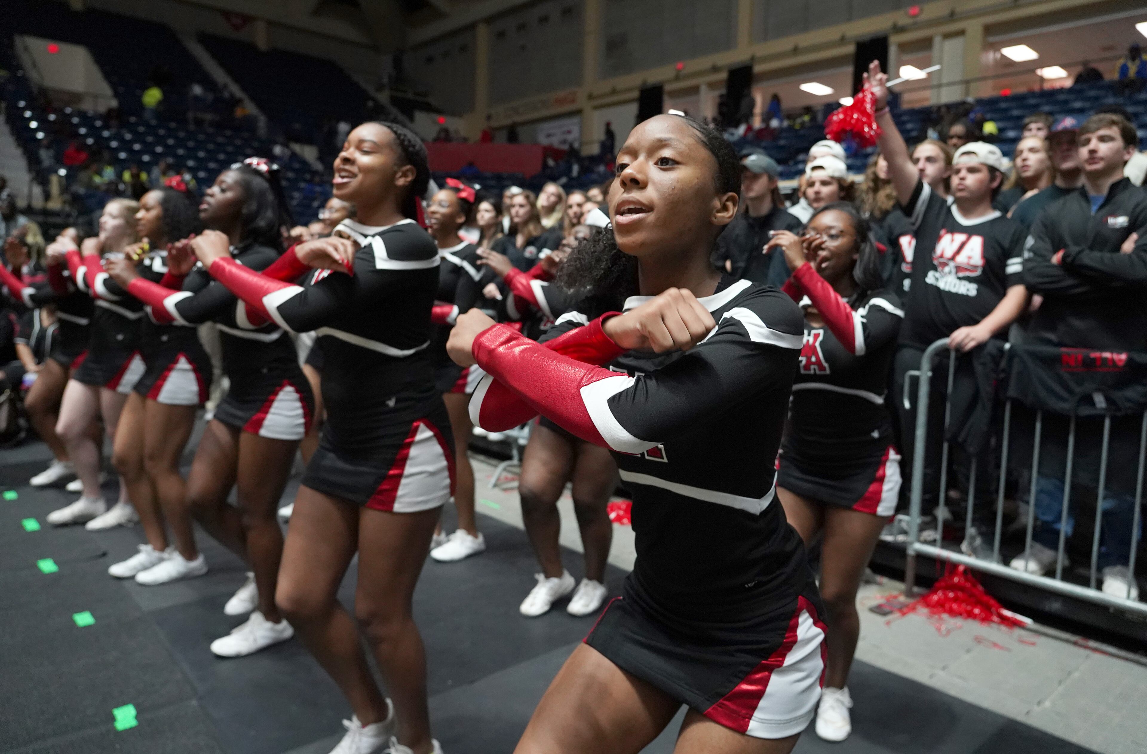 Woodward Academy cheerleaders cheer at their game against Cross Creek at the Class AAAA boys title basketball game at the Macon Centreplex, Friday March 6, 2020, in Macon. Tami Chappell for the Atlanta Journal Constitution