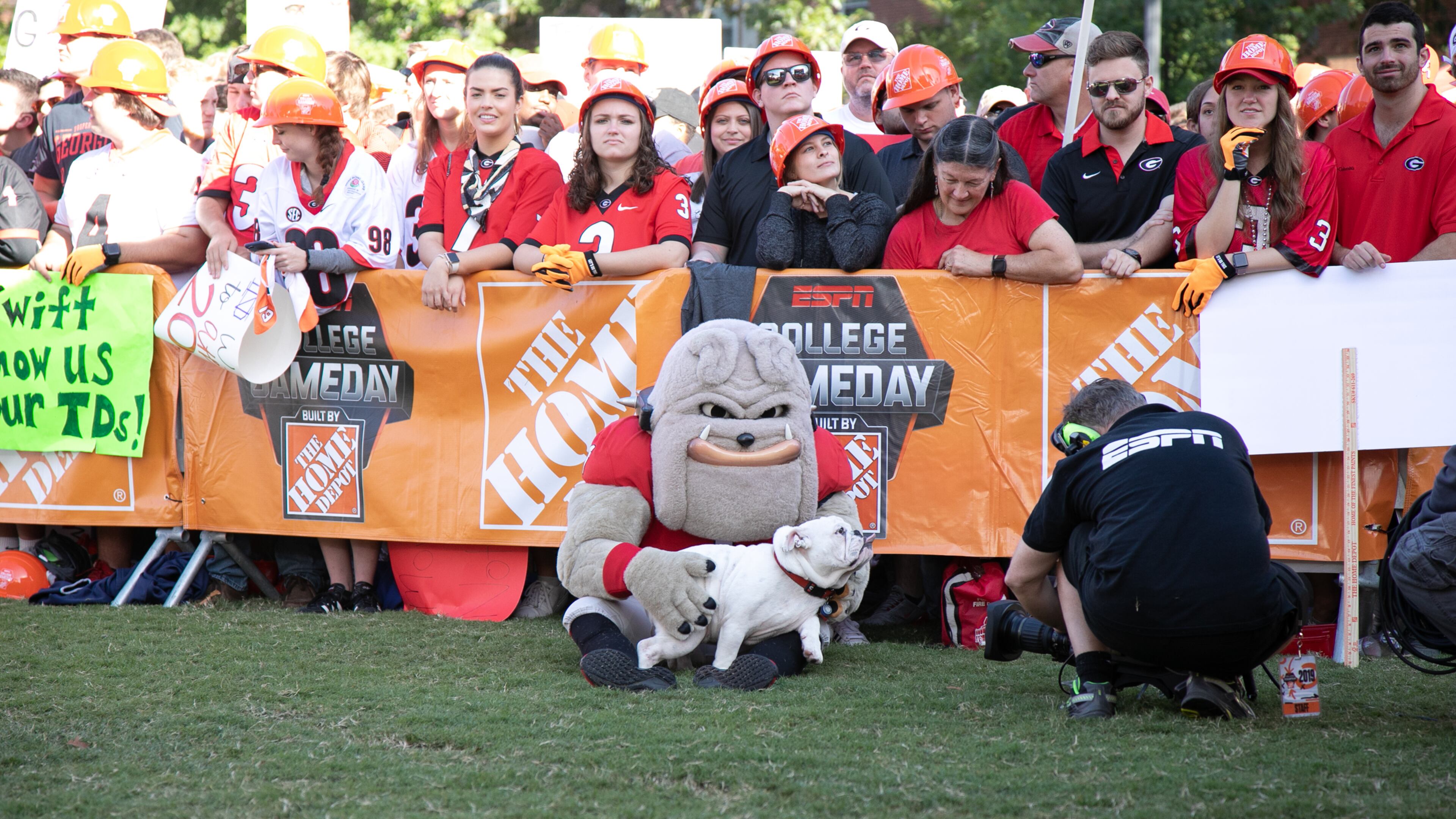 'Kirby,' a 6-month-old English bulldog puppy, snuggles with his new best friend, UGA mascot Hairy Dawg, at the ESPN College Game Day setup this past Saturday on UGA's Myers Quad.