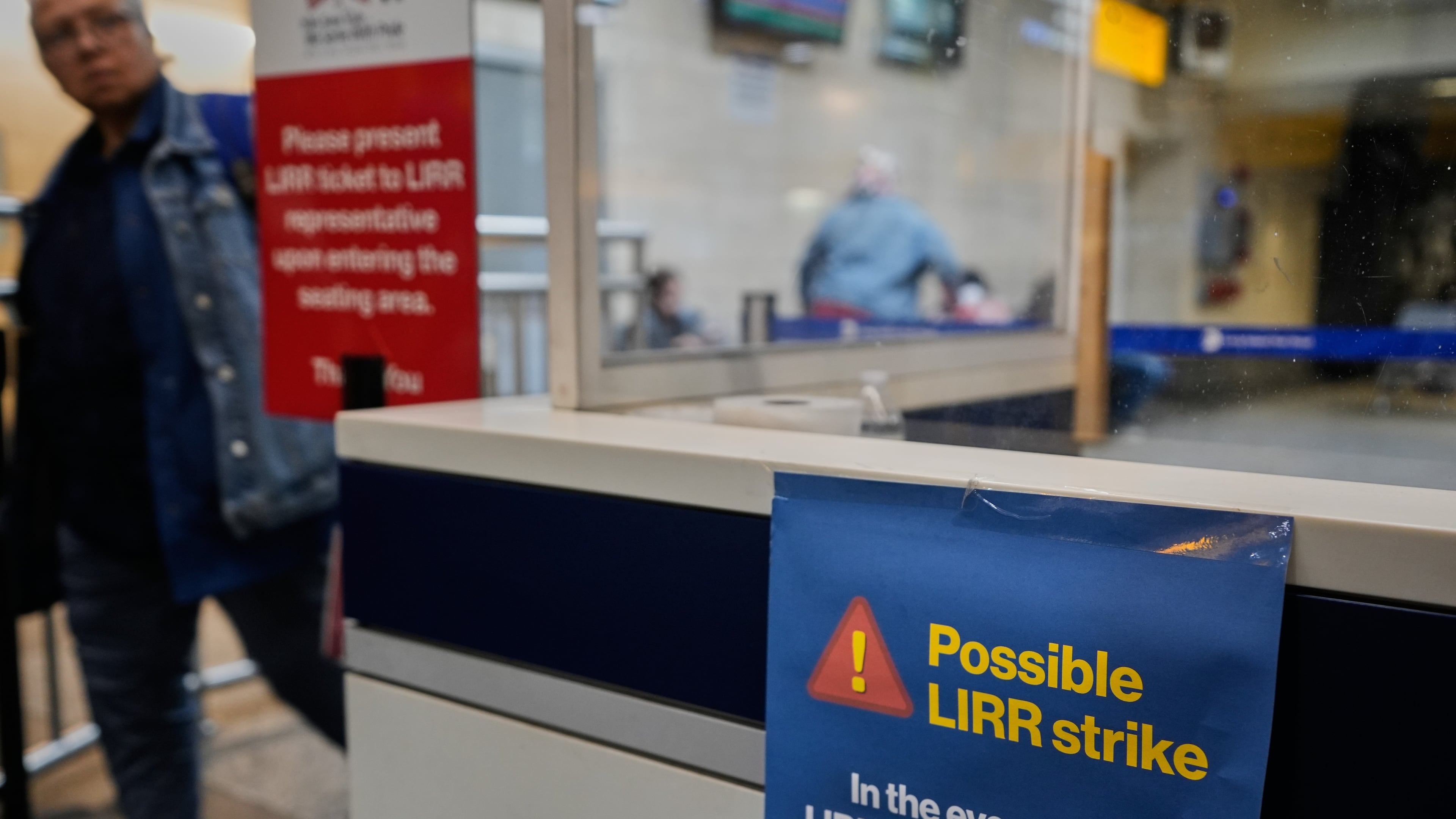 A sign warns commuters of a potential Long Island Rail Road strike at Penn Station in New York, Thursday, May 14, 2026. (AP Photo/Seth Wenig)