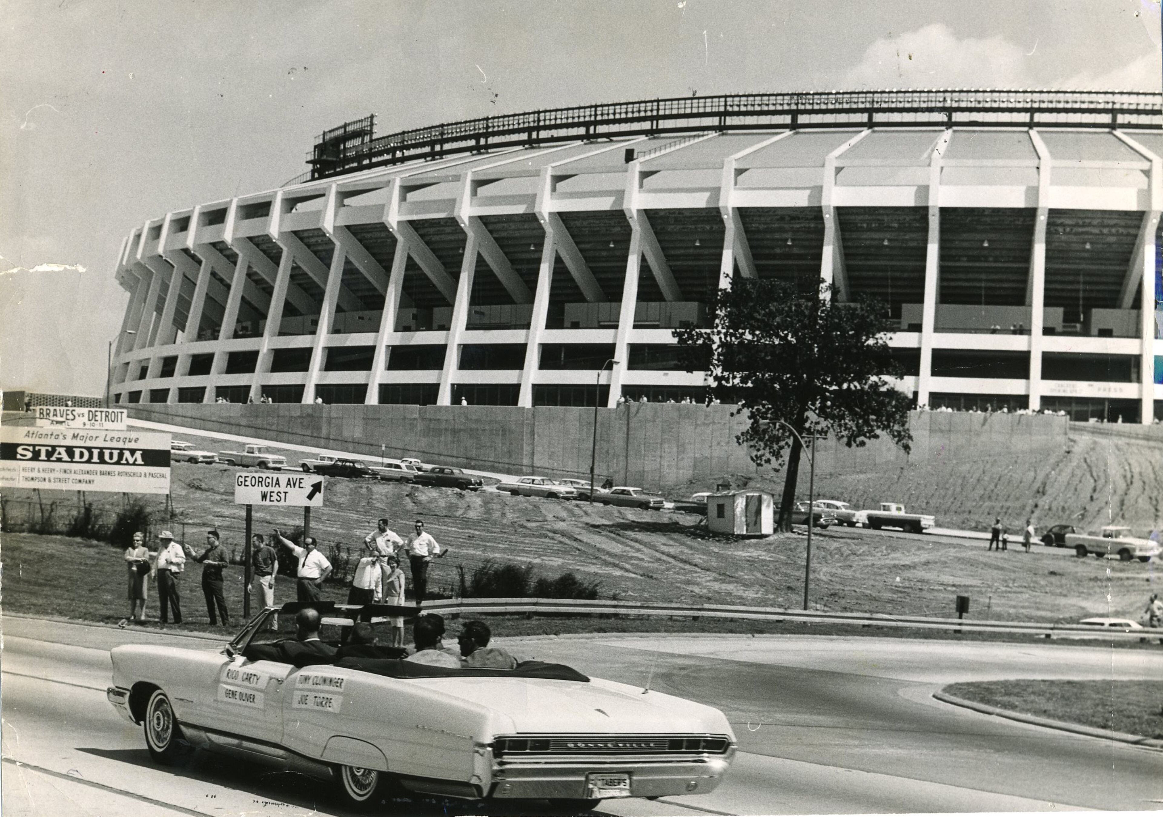 Atlanta-Fulton County Stadium, shown here on April 9, 1965. Atlanta Braves players Rico Carty, Tony Cloninger, Gene Oliver and Joe Torre are riding in the convertible in the foreground. Cloninger was the starting pitcher in the Braves' first game at the stadium and Torre accounted for the Braves' only runs with 2 solo homers. AJC Archive