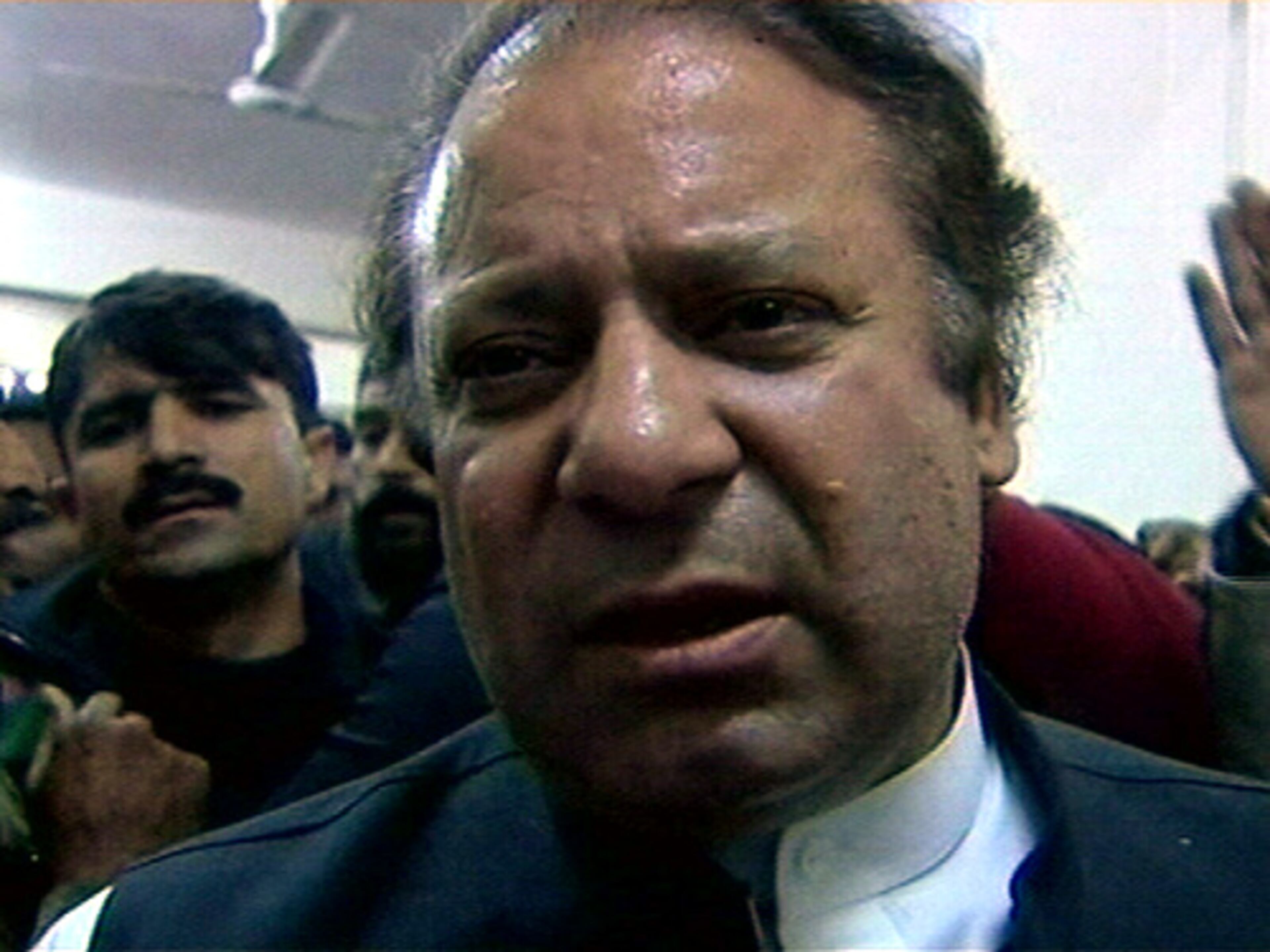 Nawaz Sharif, another former premier and opposition leader, arrived at the hospital and sat silently next to Bhutto's body. "Benazir Bhutto was also my sister, and I will be with you to take the revenge for her death," he said.