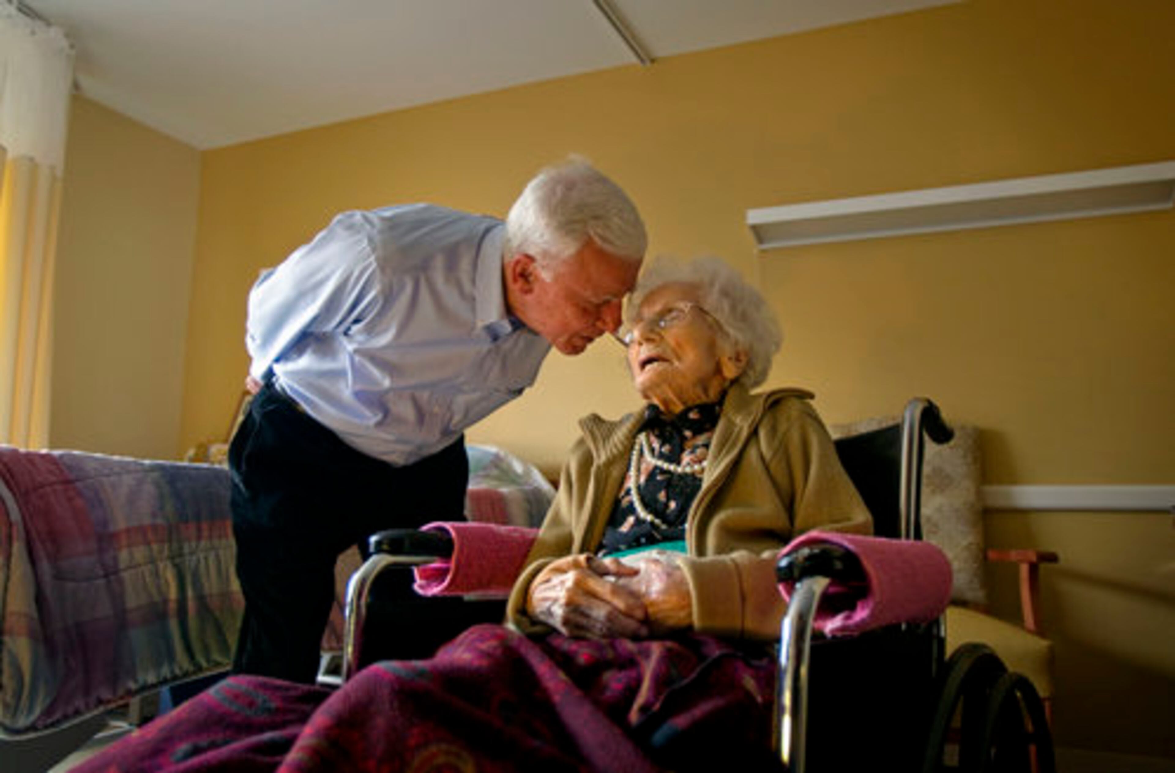 Besse Cooper, right, 114 years and five months old, talks with her son Sid Cooper in her room at a nursing home Tuesday, Feb. 1, 2011 in Monroe, Ga. Cooper is now the world's oldest person, according to the Los Angeles-based Gerontology Research Group.