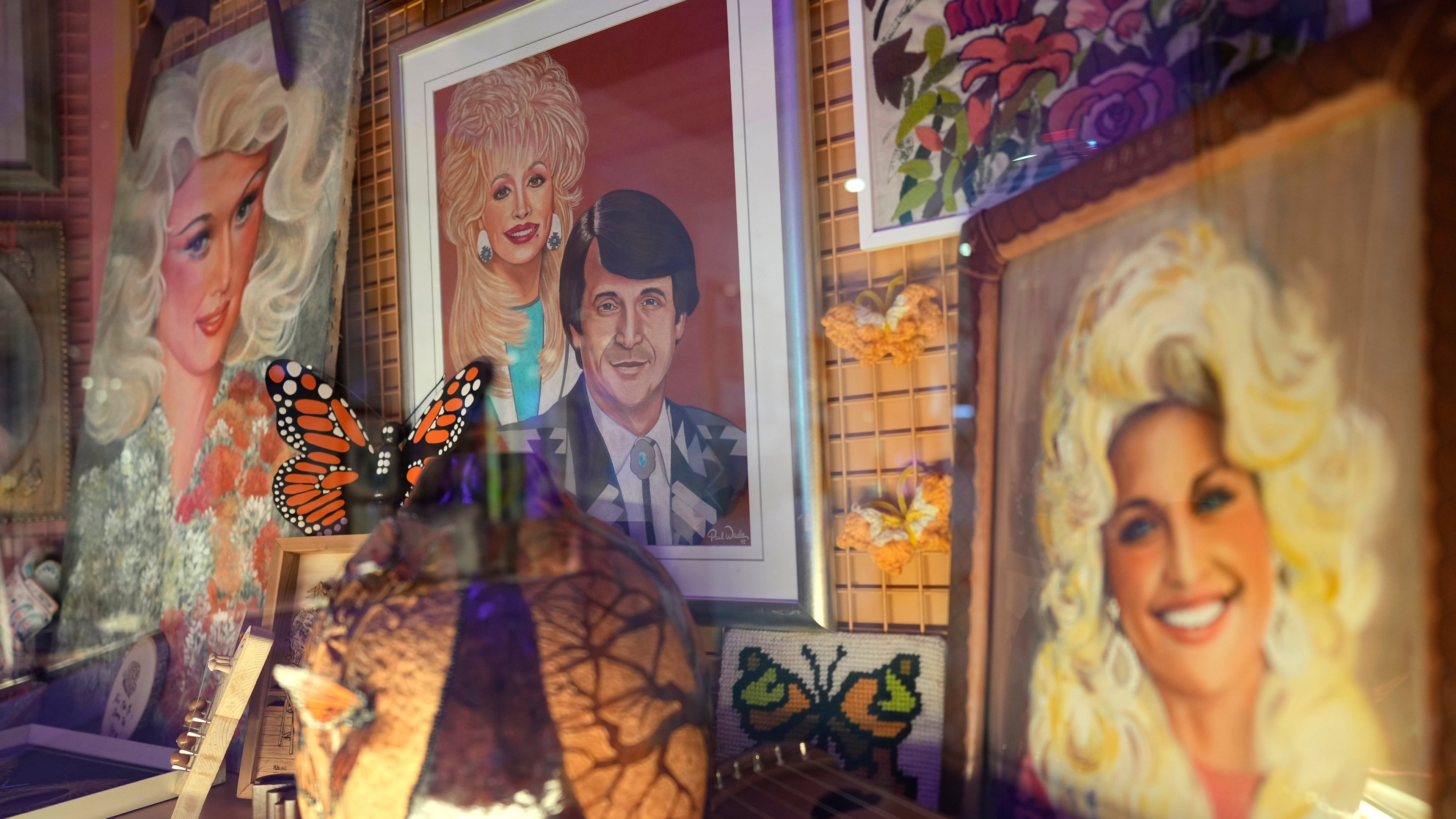 Portraits of Dolly Parton are seen at the Dolly's Life of Many Colors Museum, Tuesday, Oct. 6, 2026, in Nashville, Tenn. (AP Photo/George Walker IV)