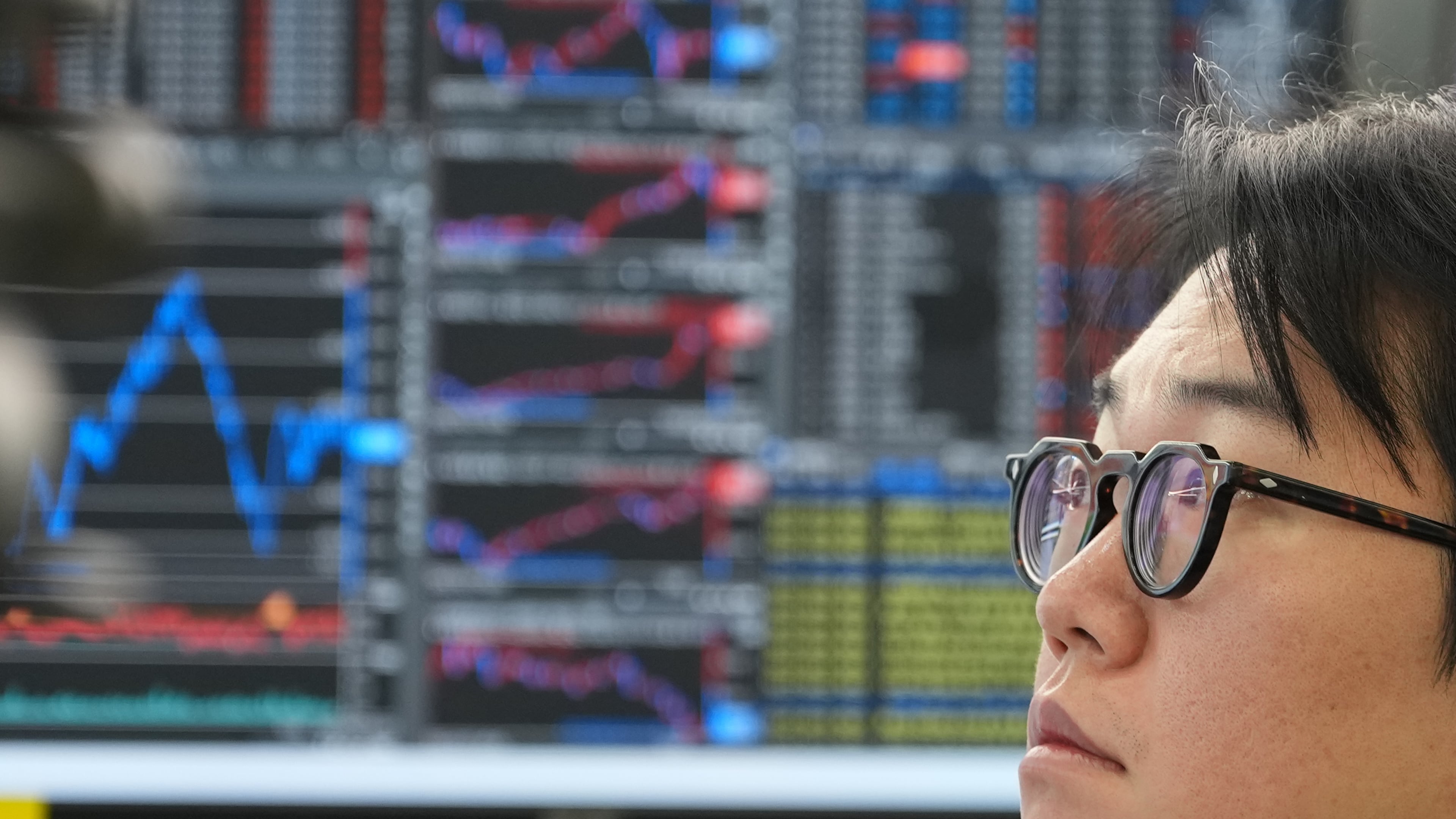 A dealer watches computer monitors at a dealing room of Hana Bank in Seoul, South Korea, Tuesday, Oct. 27, 2026. (AP Photo/Lee Jin-man)