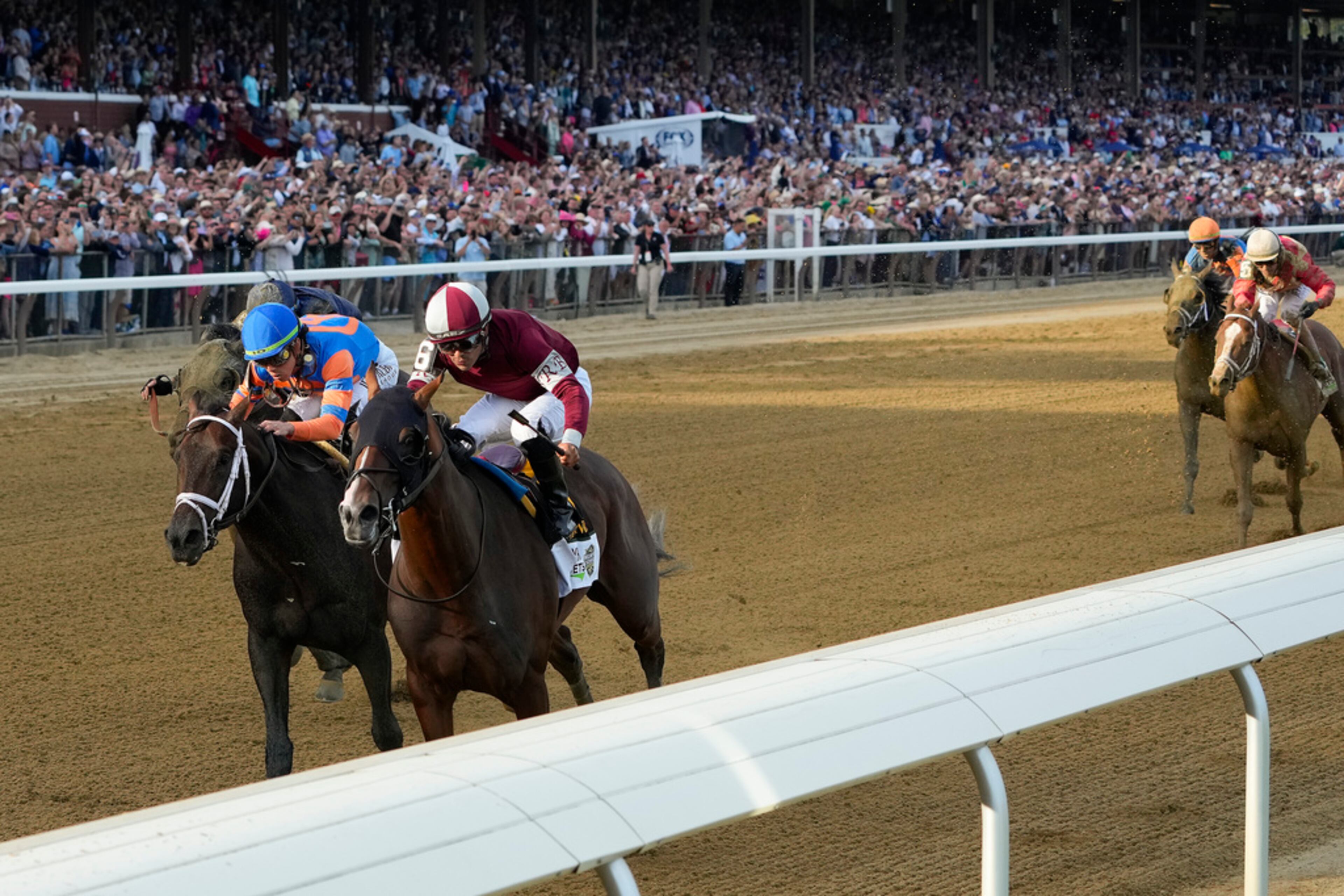 Dornoch (6), with Luis Saez up, crosses the finish line ahead of Mindframe (10), with Irad Ortiz Jr. up, to win the 156th running of the Belmont Stakes horse race, Saturday, June 8, 2024, in Saratoga Springs, N.Y. (AP Photo/Seth Wenig)