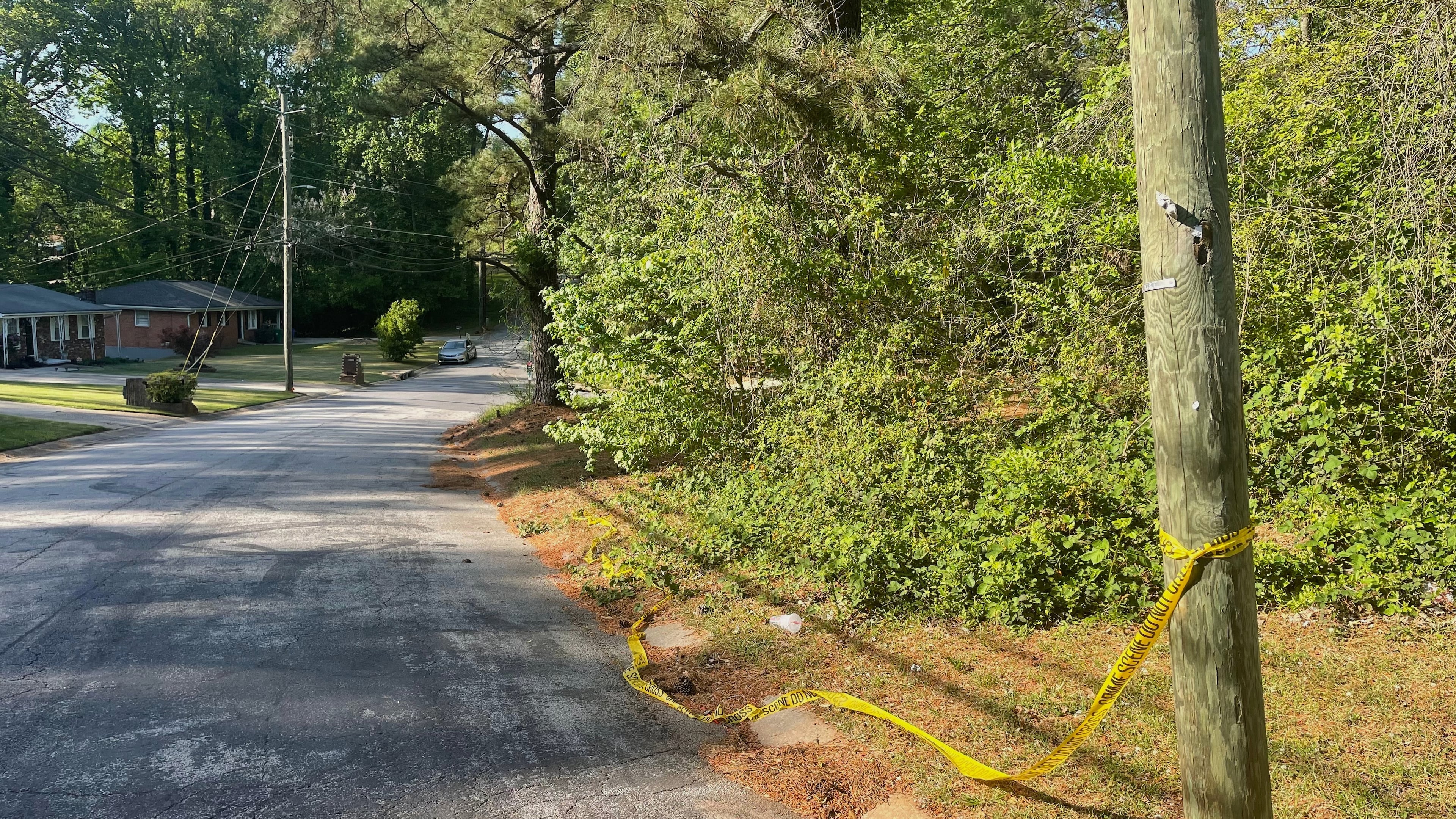 Crime scene tape is tied around a pole near the site where Lauren Bullis was killed, in Panthersville, Ga., Wednesday, April 15, 2026. (AP Photo/R.J. Rico)