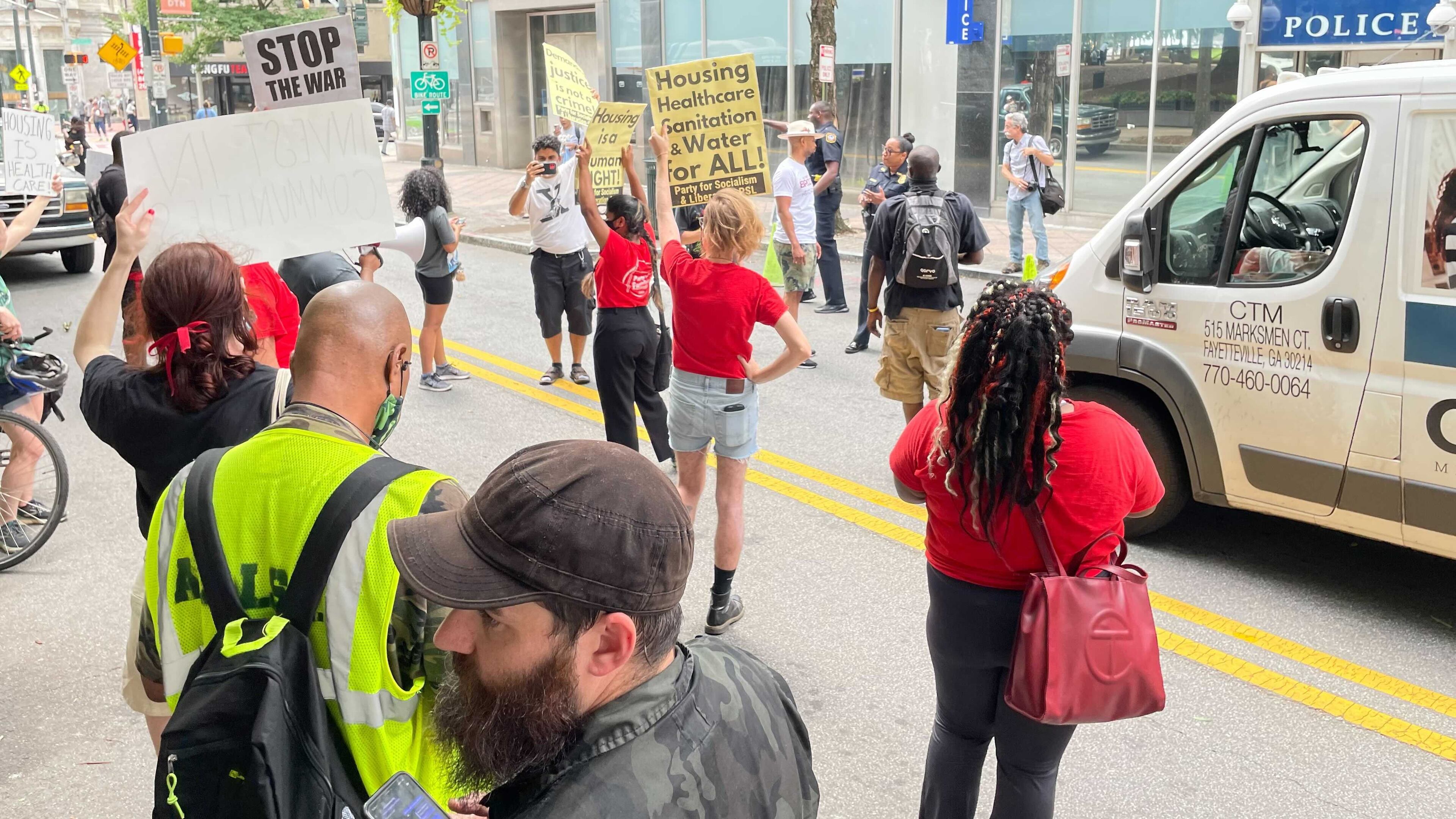 Activists gathered for a protest downtown Tuesday to urge the city to provide better services for its homeless population. (Anjali Huynh/AJC)