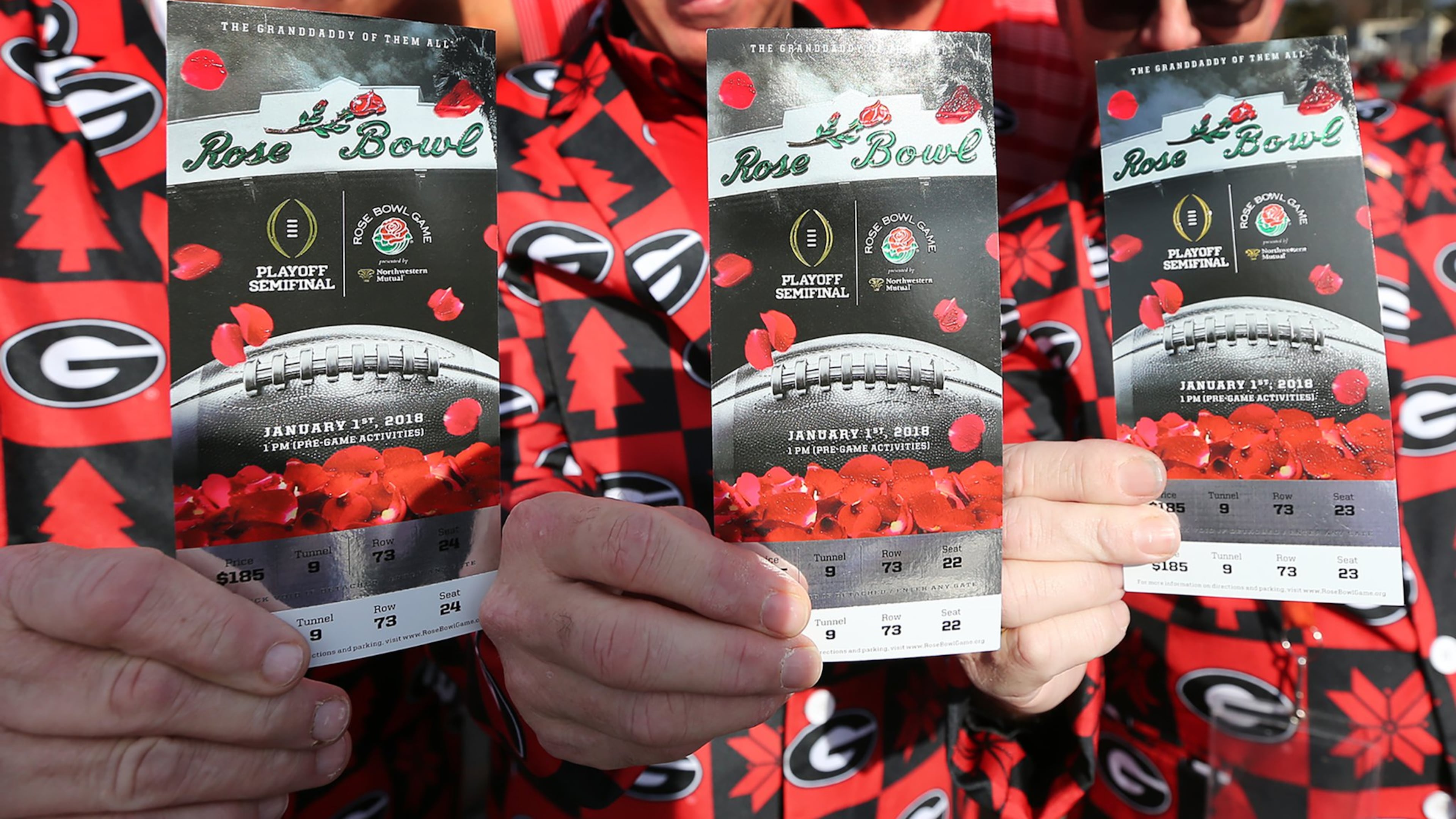 Georgia fans show off their tickets arriving for the College Football Playoff Semifinal at the Rose Bowl Game on Monday, January 1, 2018, in Pasadena. Curtis Compton/ccompton@ajc.com