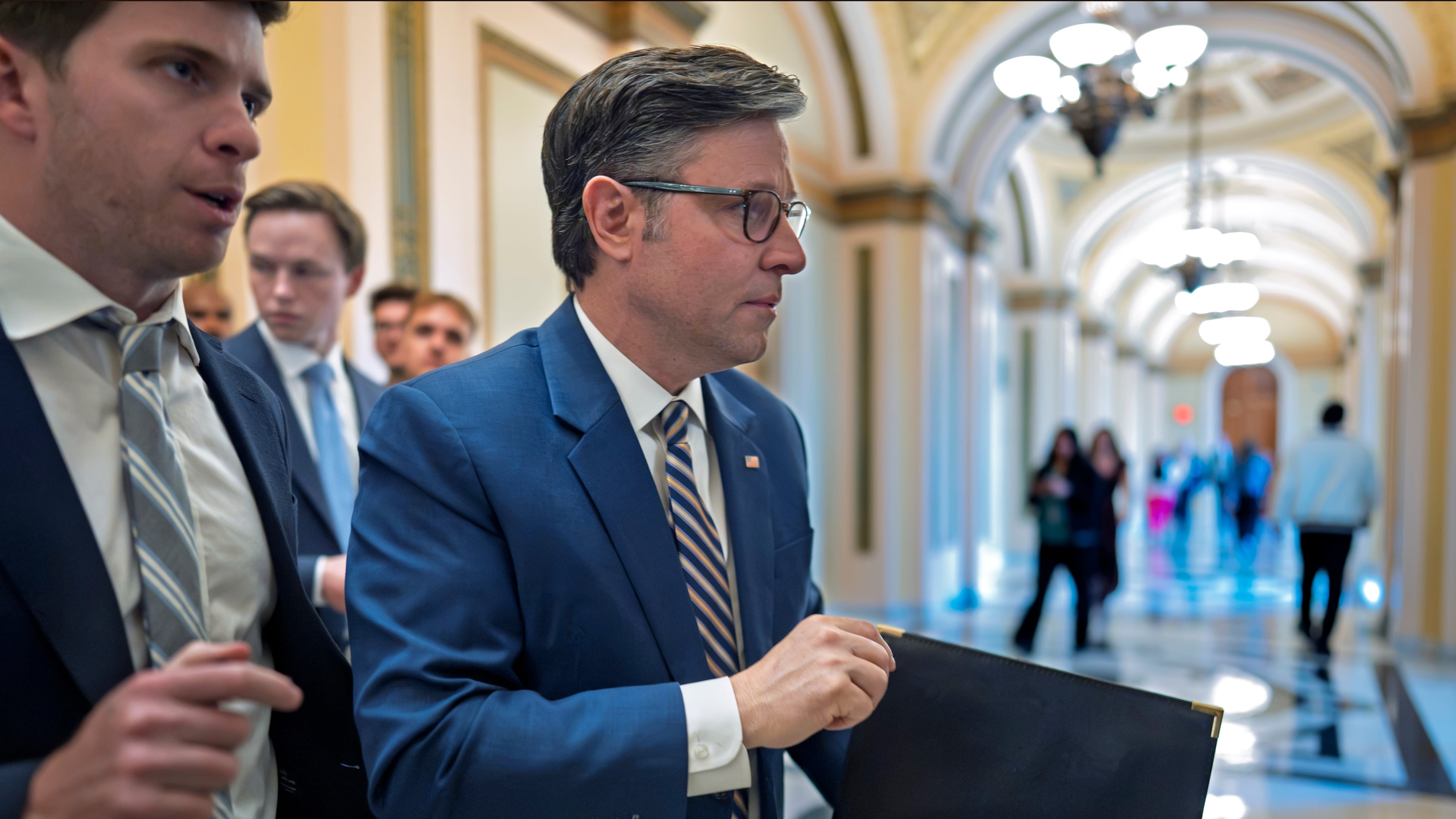 Speaker of the House Mike Johnson, R-La., leaves the chamber as members debate a series of measures including a continuing resolution to fund the government and a spending package for the Iran war, at the Capitol in Washington, Tuesday, July 21, 2026. (AP Photo/J. Scott Applewhite)