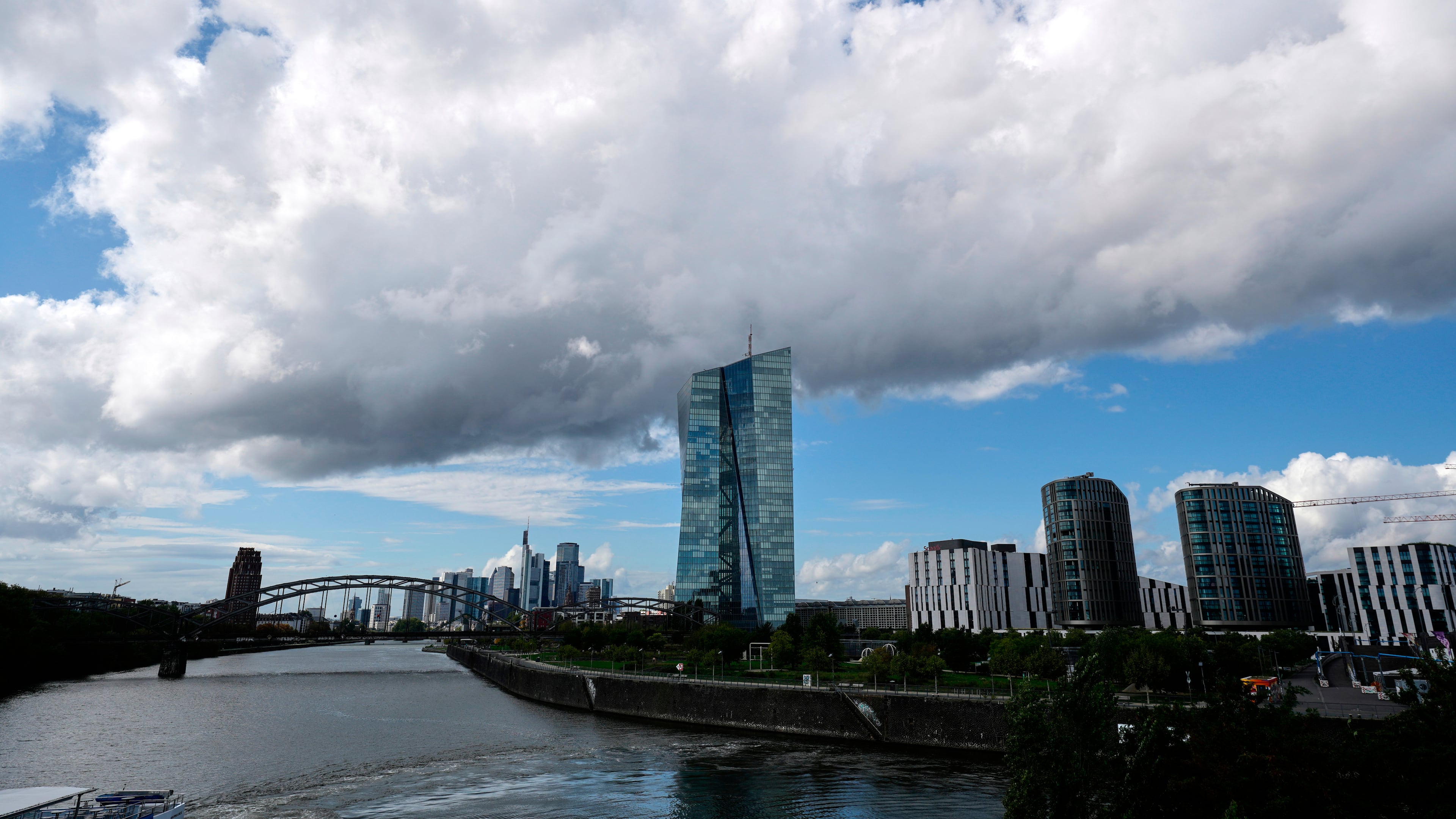 FILE -Clouds cover the sky over the headquarters of the European Central Bank in Frankfurt, Germany, Sept. 11, 2025. (AP Photo/Michael Probst, File)