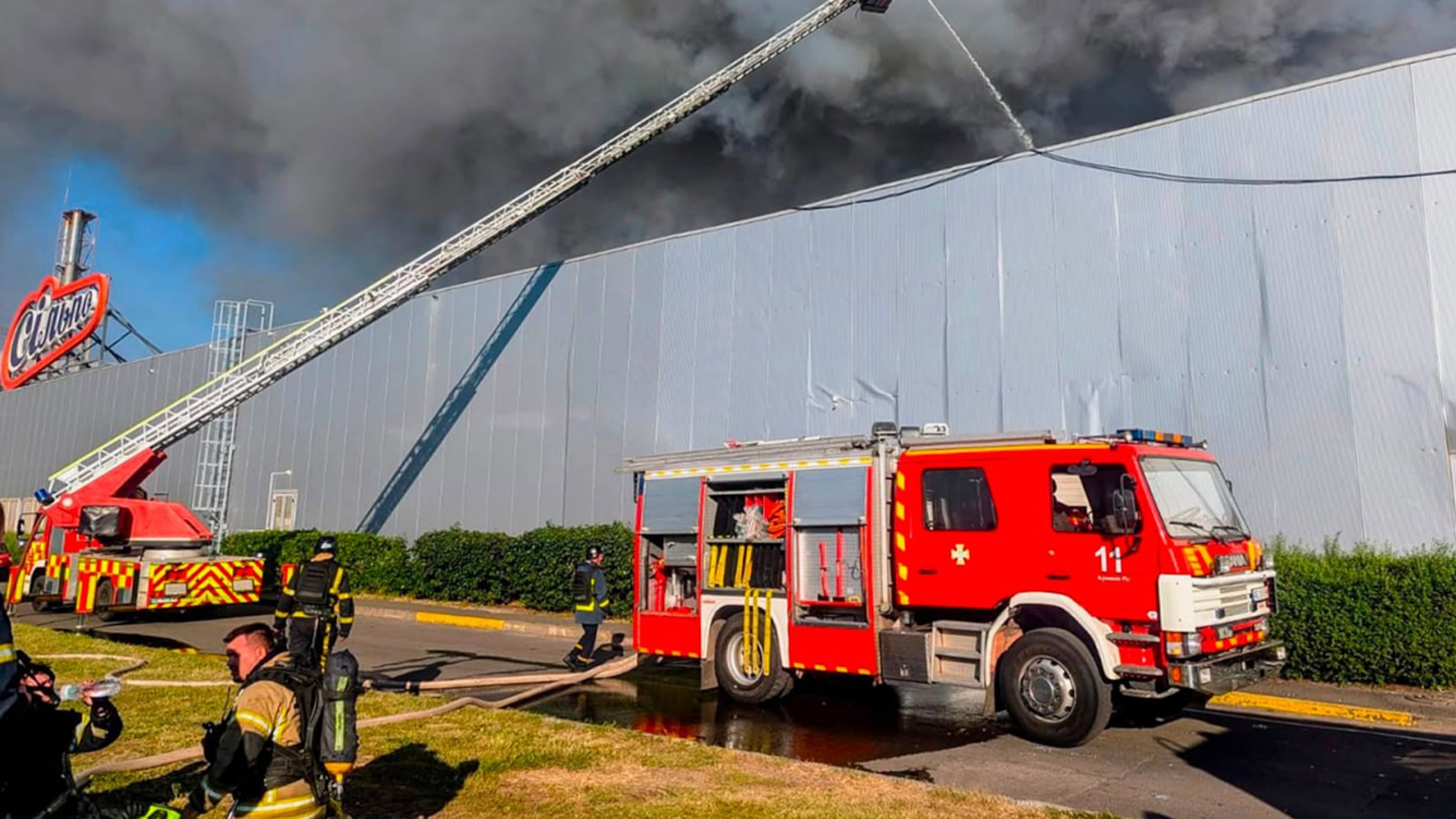 In this photo provided by the Ukrainian Emergency Service, firefighters work on a fire at a shopping mall following a Russian drone attack in Kryvyi Rih, Ukraine, Friday, Aug. 21, 2026. (Ukrainian Emergency Service via AP)