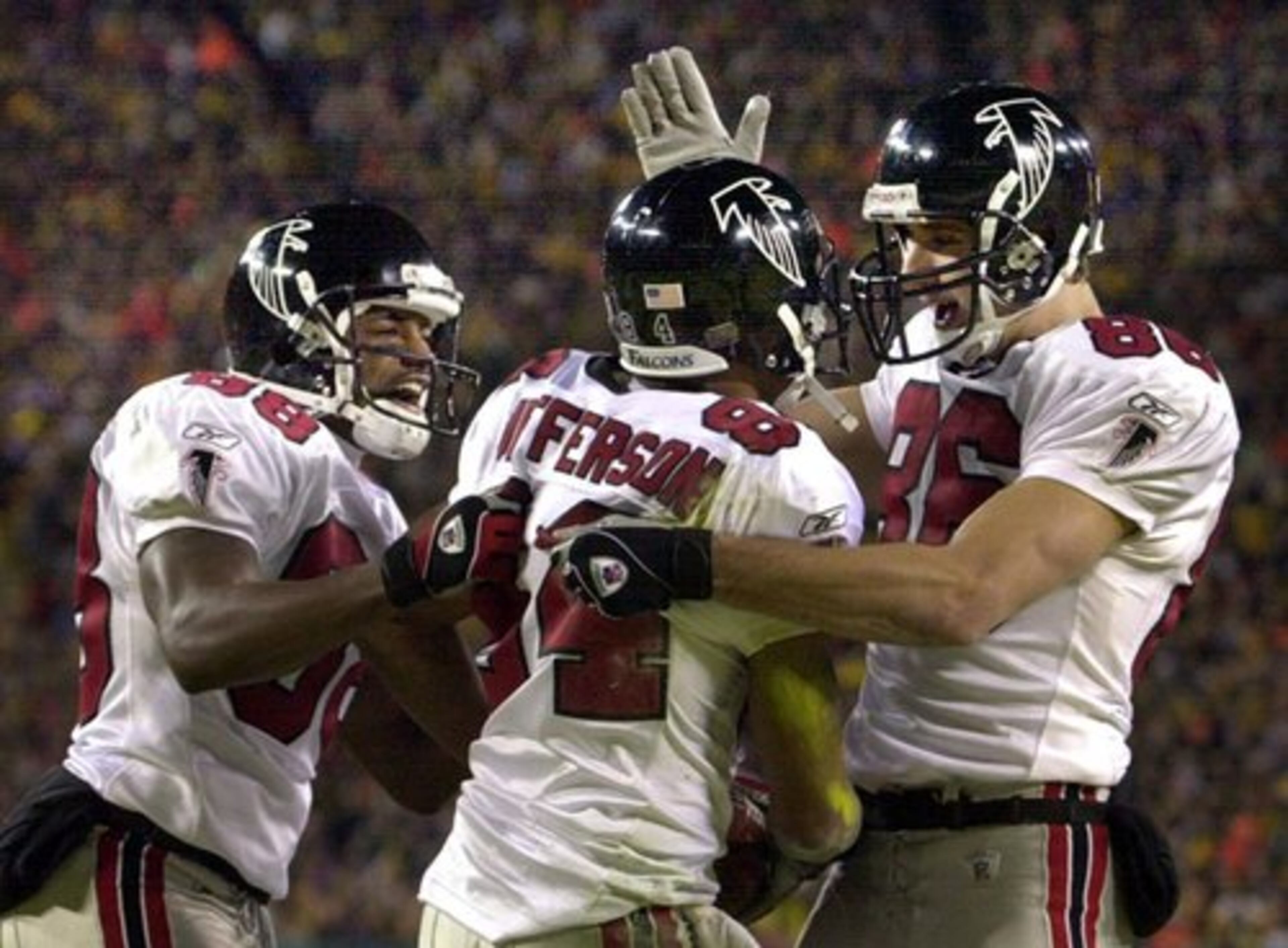 Falcons wide receivers (from left to right) Quentin McCord, Shawn Jefferson, and Brian Finneran celebrate Jefferson's touchdown catch - the first score of the game - that gave Atlanta an early lead that would quickly grow.