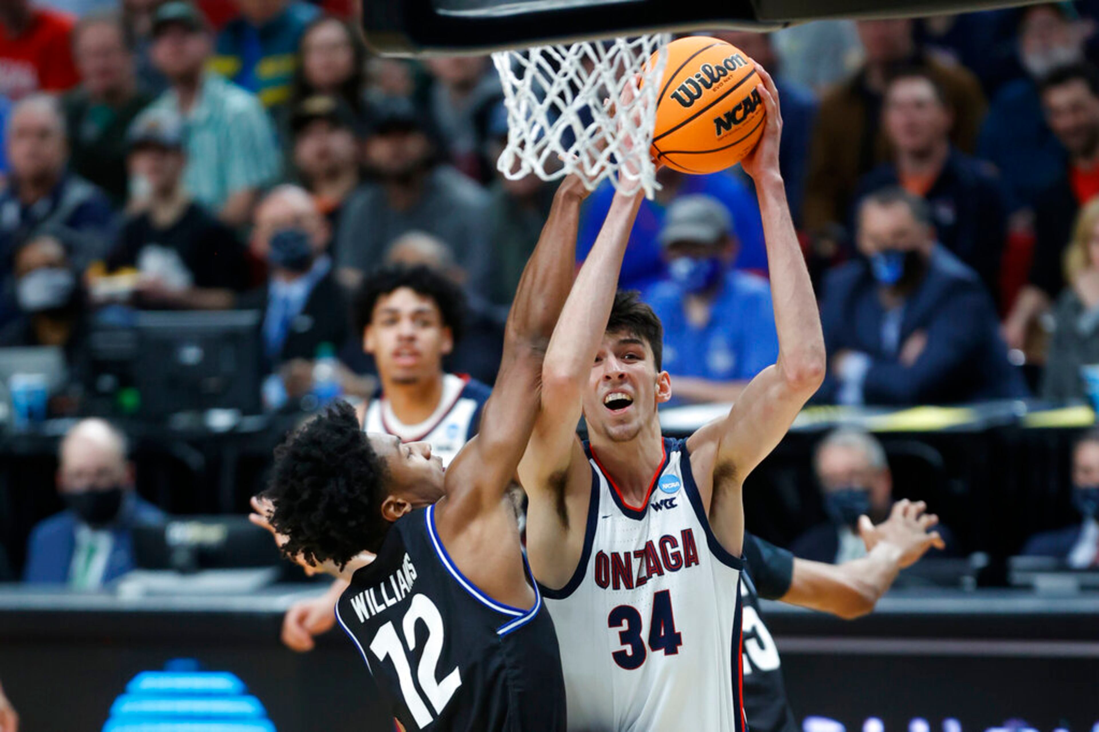 Gonzaga center Chet Holmgren (34) puts up a shot against Georgia State guard Kane Williams (12) during the first half of a first round NCAA college basketball tournament game, Thursday, March 17, 2022, in Portland, Ore. (AP Photo/Craig Mitchelldyer)