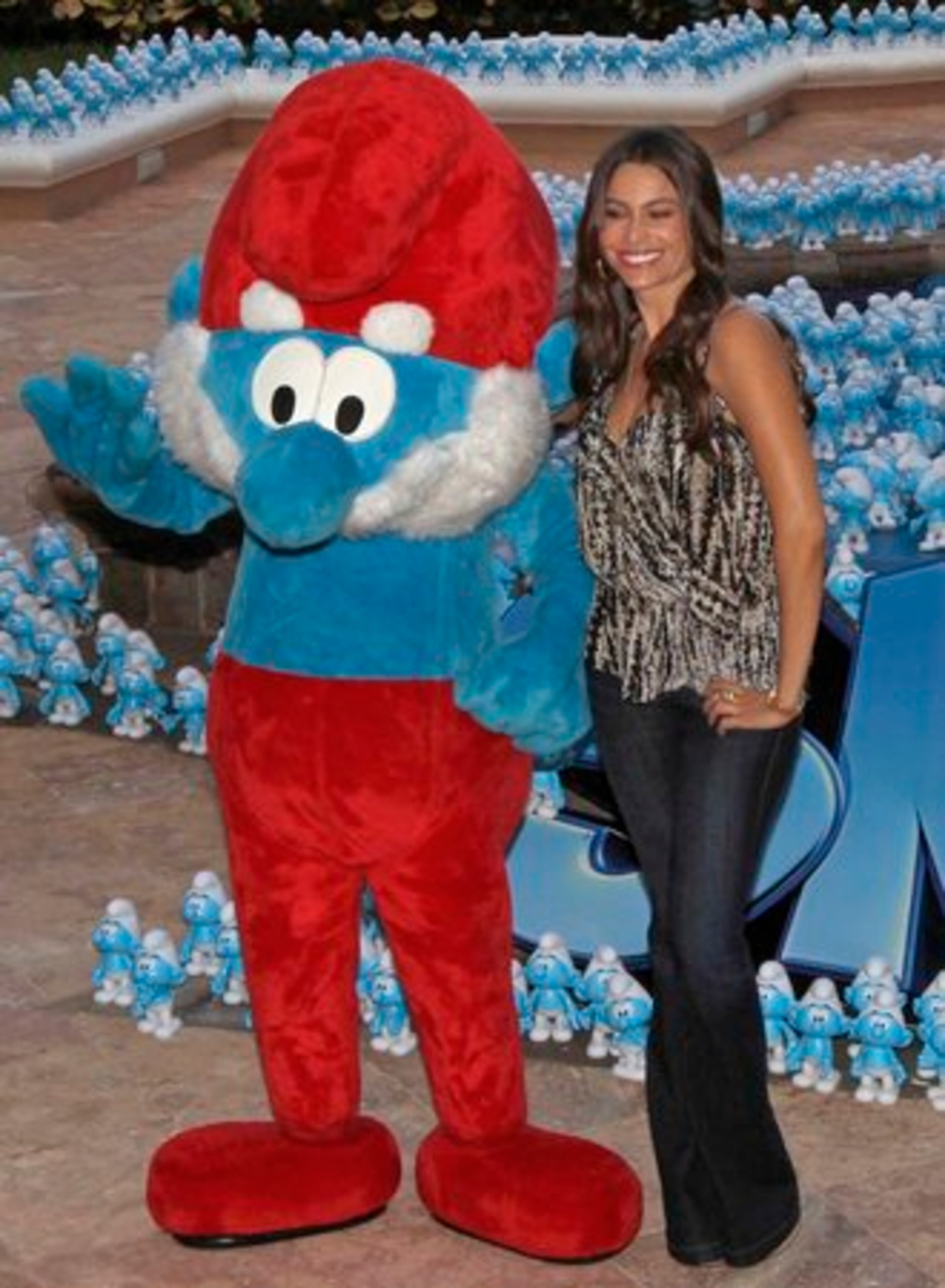 Sofia Vergara and Papa Smurf wave to fans. Readers of a certain age will remember that the Smurfs lived in a Smurf Village and used "smurf" as every other word, which was smurfing hilarious at the time.
