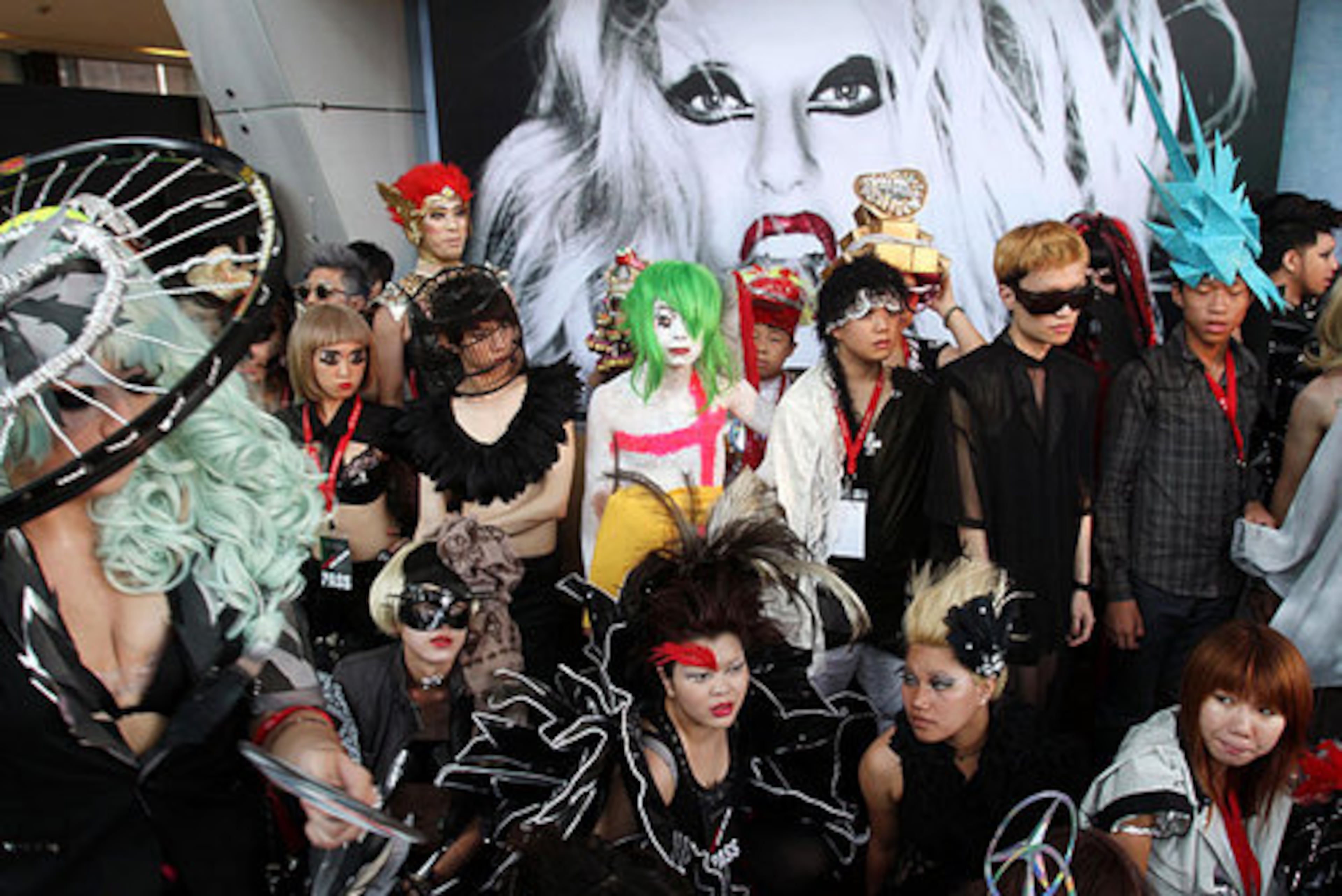 Fans of international pop sensation Lady Gaga dress in costume during a "Lady Gaga Day" fashion show held before her evening mini concert in Taichung, Taiwan, Sunday, July 3, 2011.