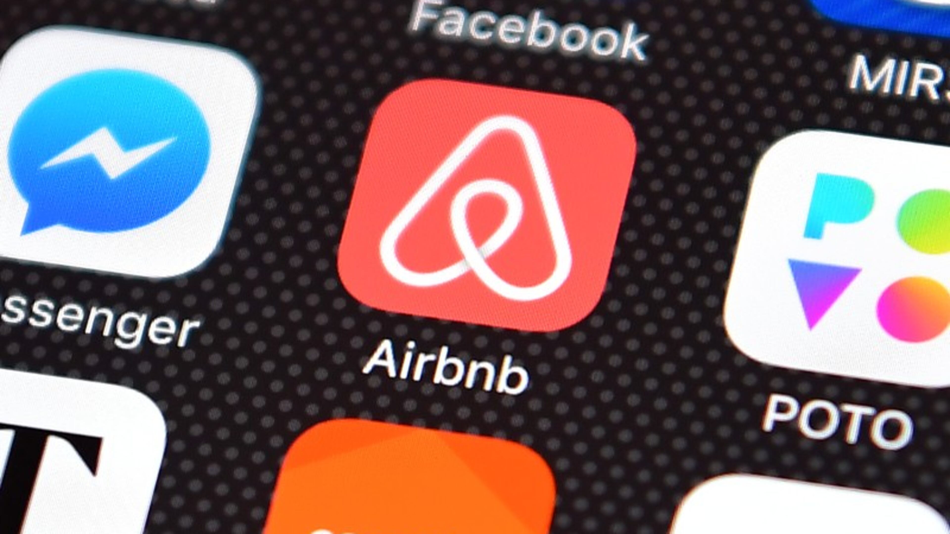 The Airbnb app logo is displayed on an iPhone on Aug. 3, 2016.