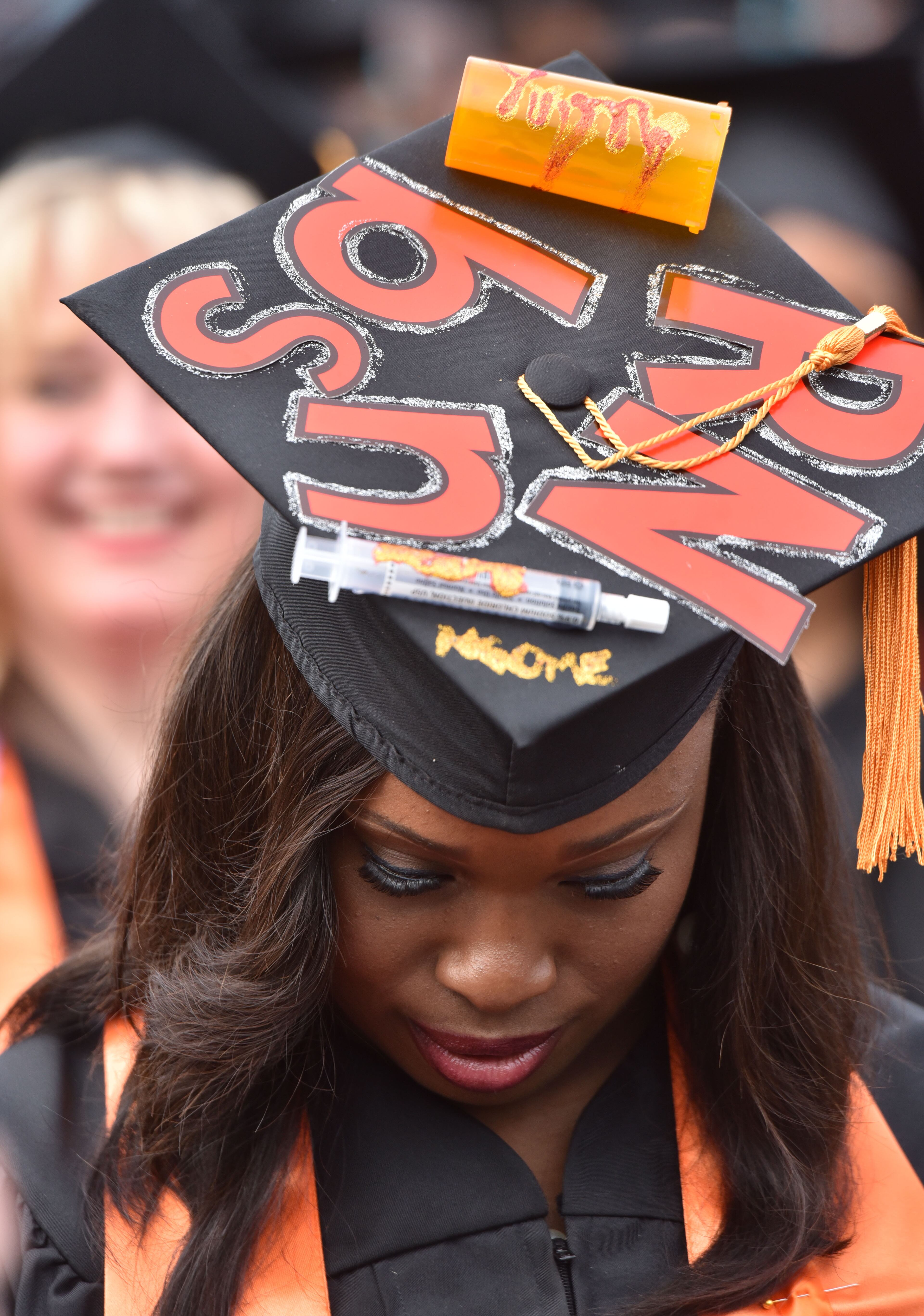May 16, 2015 Atlanta - Nursing student Yvonne Ngome wears a personalized mortar board during Mercer University's Atlanta campus commencement on Saturday, May 16, 2015. More than 1,800 students will graduate in five Mercer University commencements during May in Macon, Atlanta and Savannah. Atlanta campus commencement was the largest of Mercer University's five commencement ceremonies. About 978 graduates received degrees. HYOSUB SHIN / HSHIN@AJC.COM