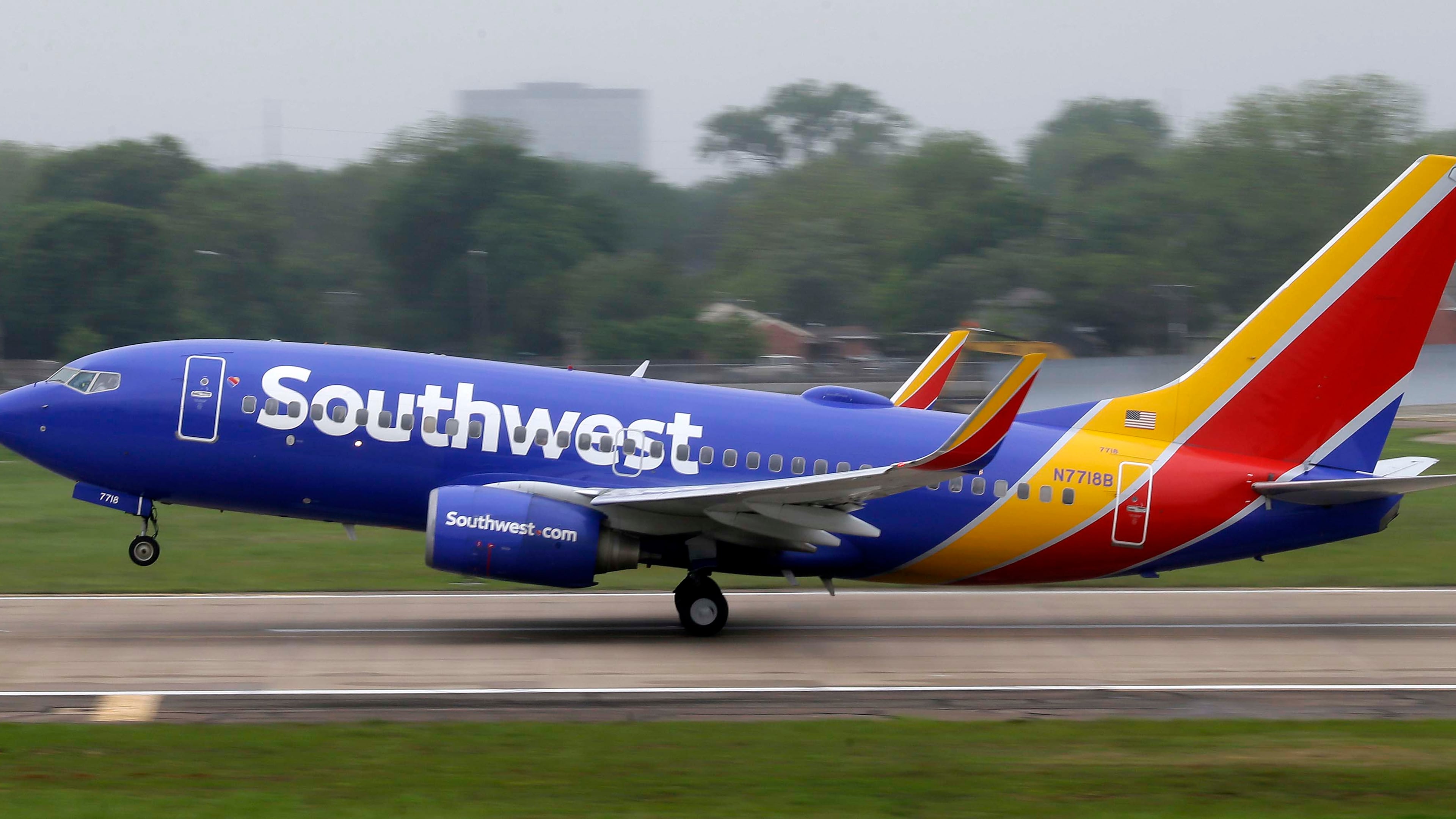 FILE- In this April 23, 2015, file photo, a Southwest airlines jet takes off from a runway at Love Field in Dallas. Southwest Airlines is asking travelers on Sunday, Oct. 11, to arrive at least two hours before their scheduled departures as technical issues are forcing it to check-in some customers manually. (AP Photo/LM Otero, File)