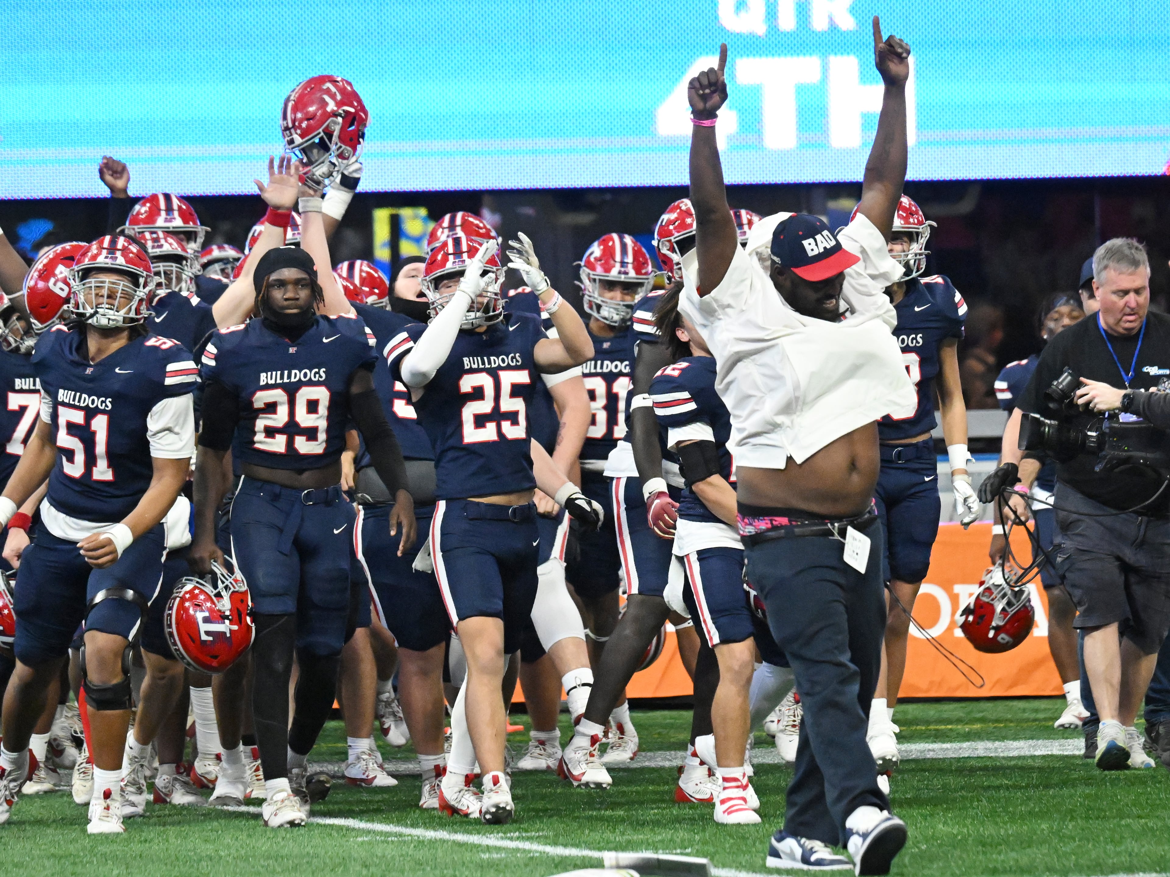 Toombs County players and coaching staff celebrate at the fourth quarter in GHSA Class A-Division State Championship game at Mercedes-Benz Stadium, Tuesday, December 17, 2024, in Atlanta. Toombs County won 38-18 over Northeast Macon. (Hyosub Shin / AJC)