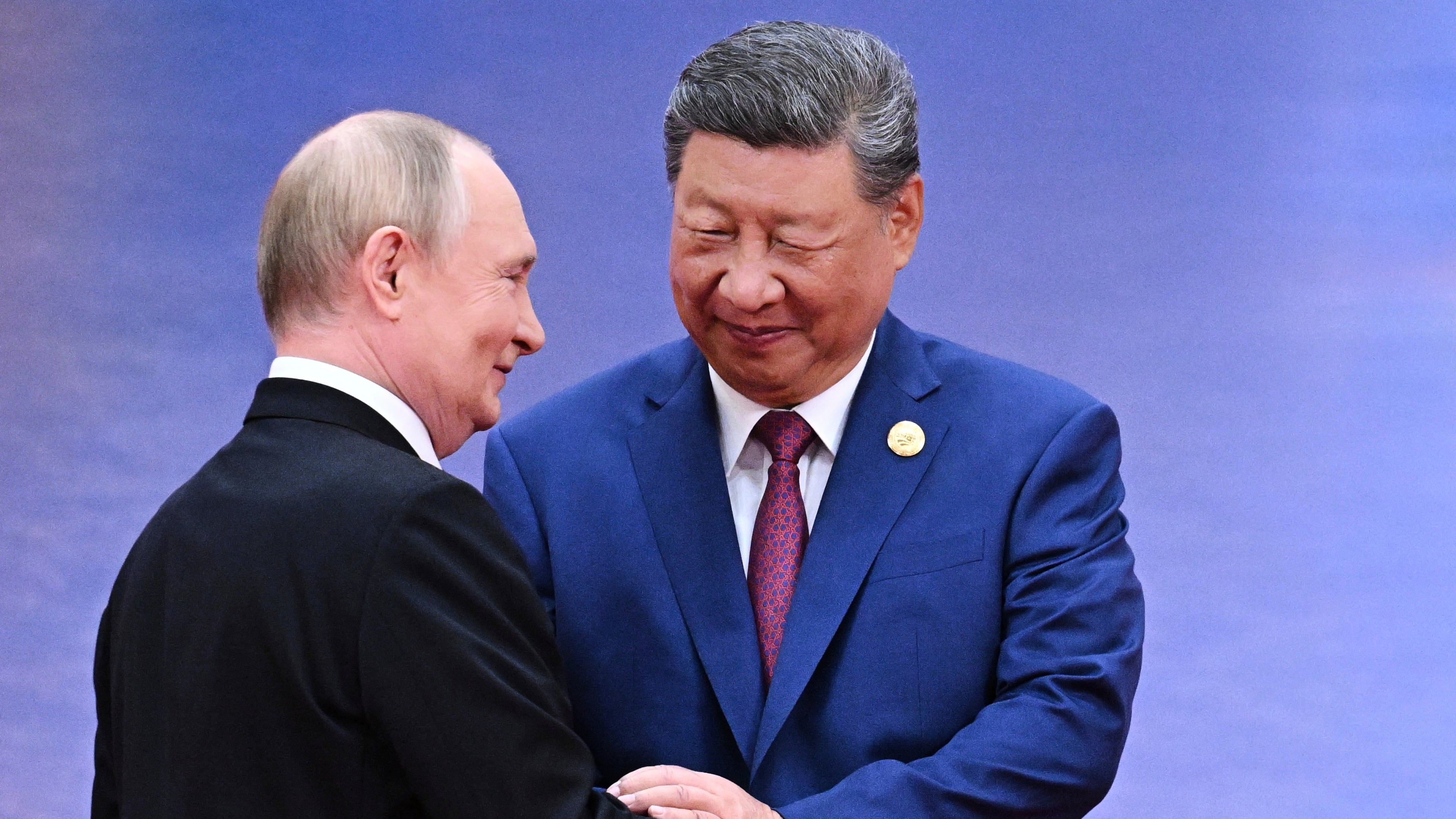 FILE - Russian President Vladimir Putin, left, and Chinese President Xi Jinping greet each other in Tianjin, China, on Aug. 31, 2025. (Sergei Bobylev, Sputnik, Kremlin Pool Photo via AP, File)