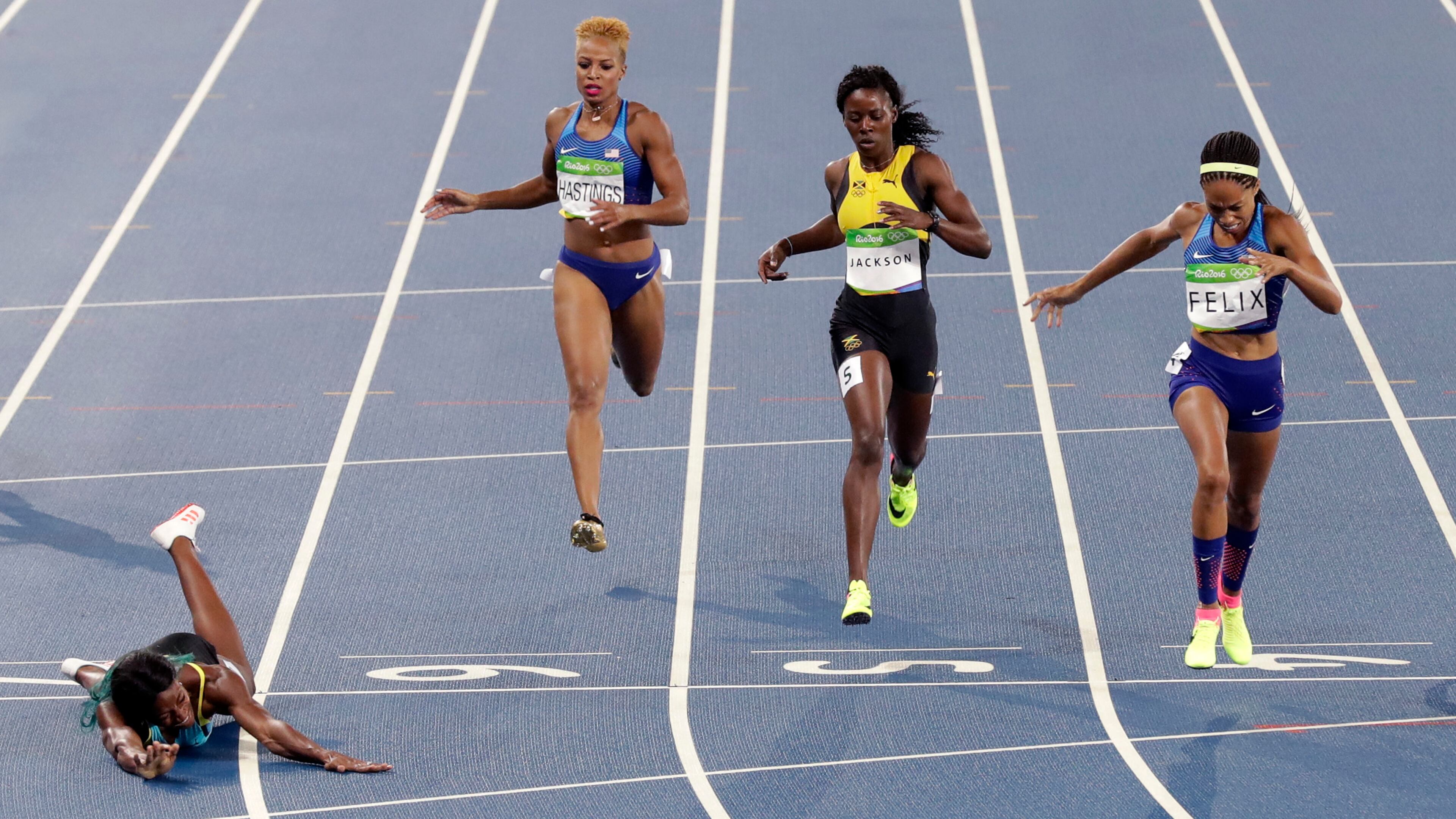 Bahamas' Shaunae Miller, left, beats United States' Allyson Felix, second right, to win the women's 400-meter final during the athletics competitions of the 2016 Summer Olympics at the Olympic stadium in Rio de Janeiro, Brazil, Monday, Aug. 15, 2016. (AP Photo/Martin Meissner)