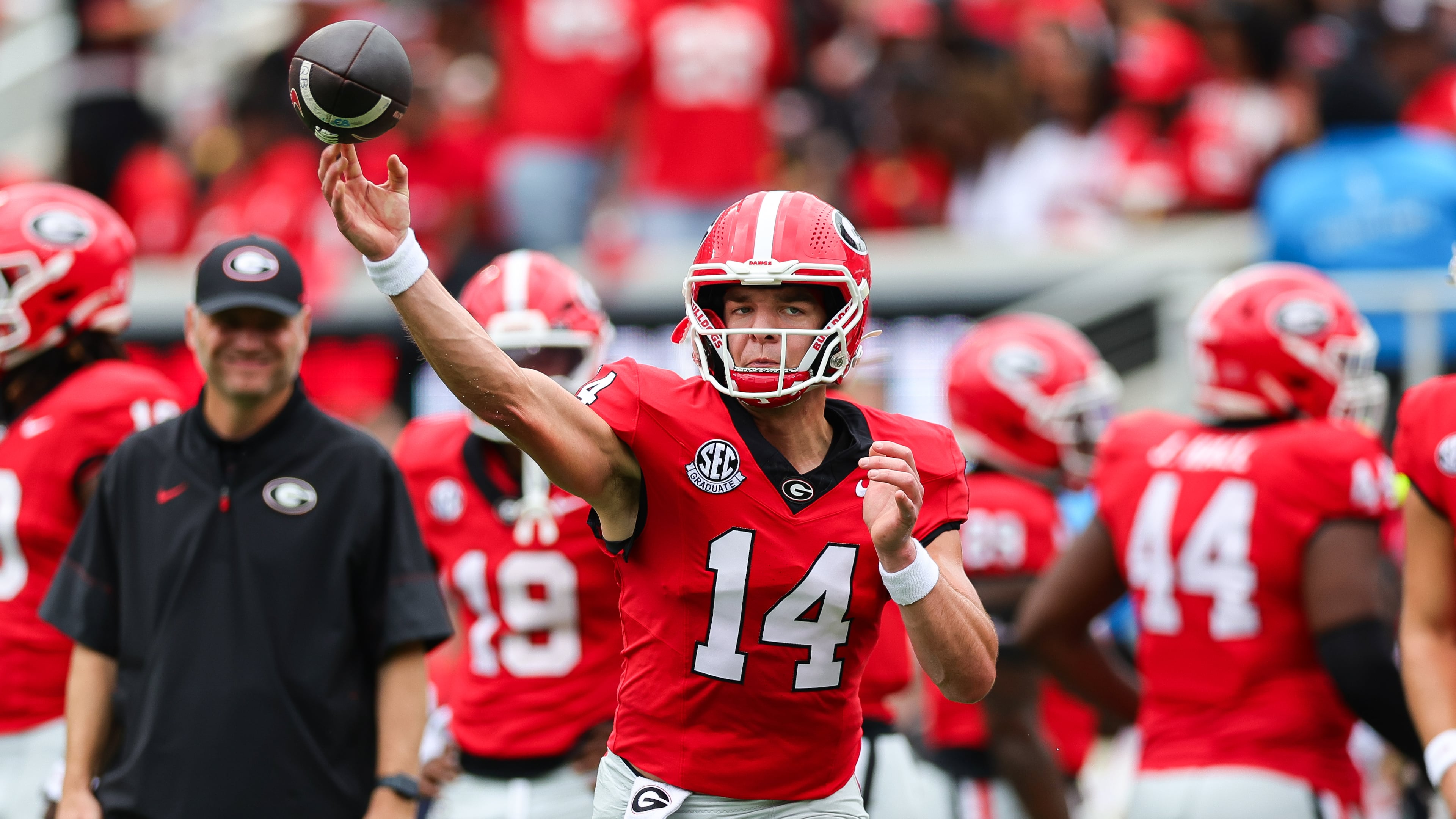 Georgia quarterback Gunner Stockton (14) throws during warm ups before an NCAA college football game against Vanderbilt, Saturday, Oct. 3, 2026, in Athens, Ga. (AP Photo/Colin Hubbard)