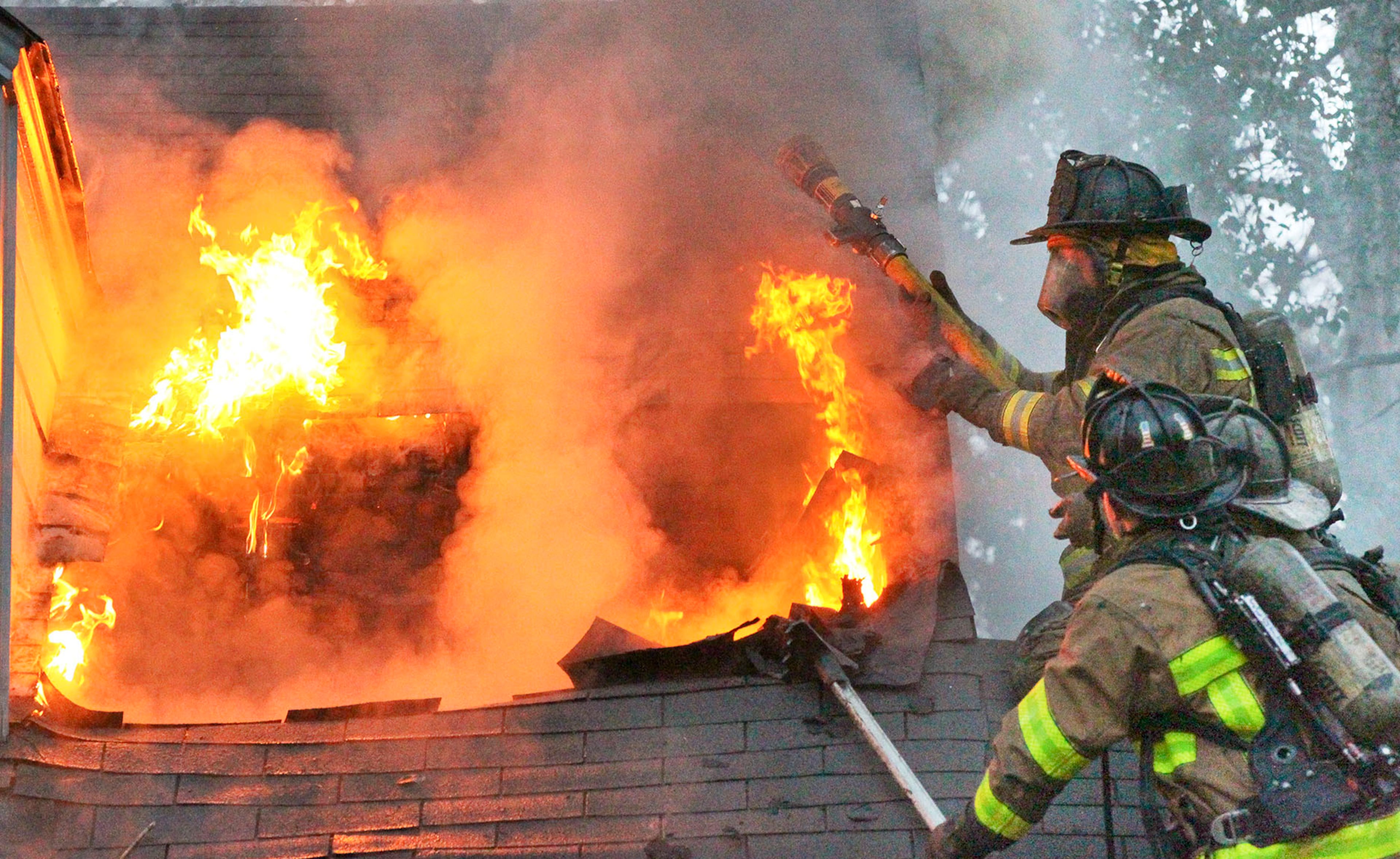 LEDE PHOTO - Mar. 8, 2013, 2013 Atlanta: Firefighters aggressively go after the fire Friday. Atlanta firefighters battled a blaze early Friday, Mar. 8, 2013 at a home in a Buckhead neighborhood. The fire broke out shortly before 6:30 a.m. in the 2500 block of Dellwood Drive off West Wesley Road. Flames could be seen shooting from the windows on the second floor of the large two-story home. No one was at home when the fire broke out, and no injuries were reported. The home was being rented by four college friends who graduated together from Auburn University. One of those friends was Francie McMath, who found out about the fire when she returned home from working an overnight shift as a nurse in the cardiac intensive care unit at Emory University Hospital. "I drove up to about 10 fire trucks and lots of flames," McMath said. "I'm in total shock right now. It's awful." Miller said the home appeared to be a total loss. "I'm just glad no one was here, and everybody's okay," McMath said. "We all have renter's insurance, so that's good." JOHN SPINK / JSPINK@AJC.COM