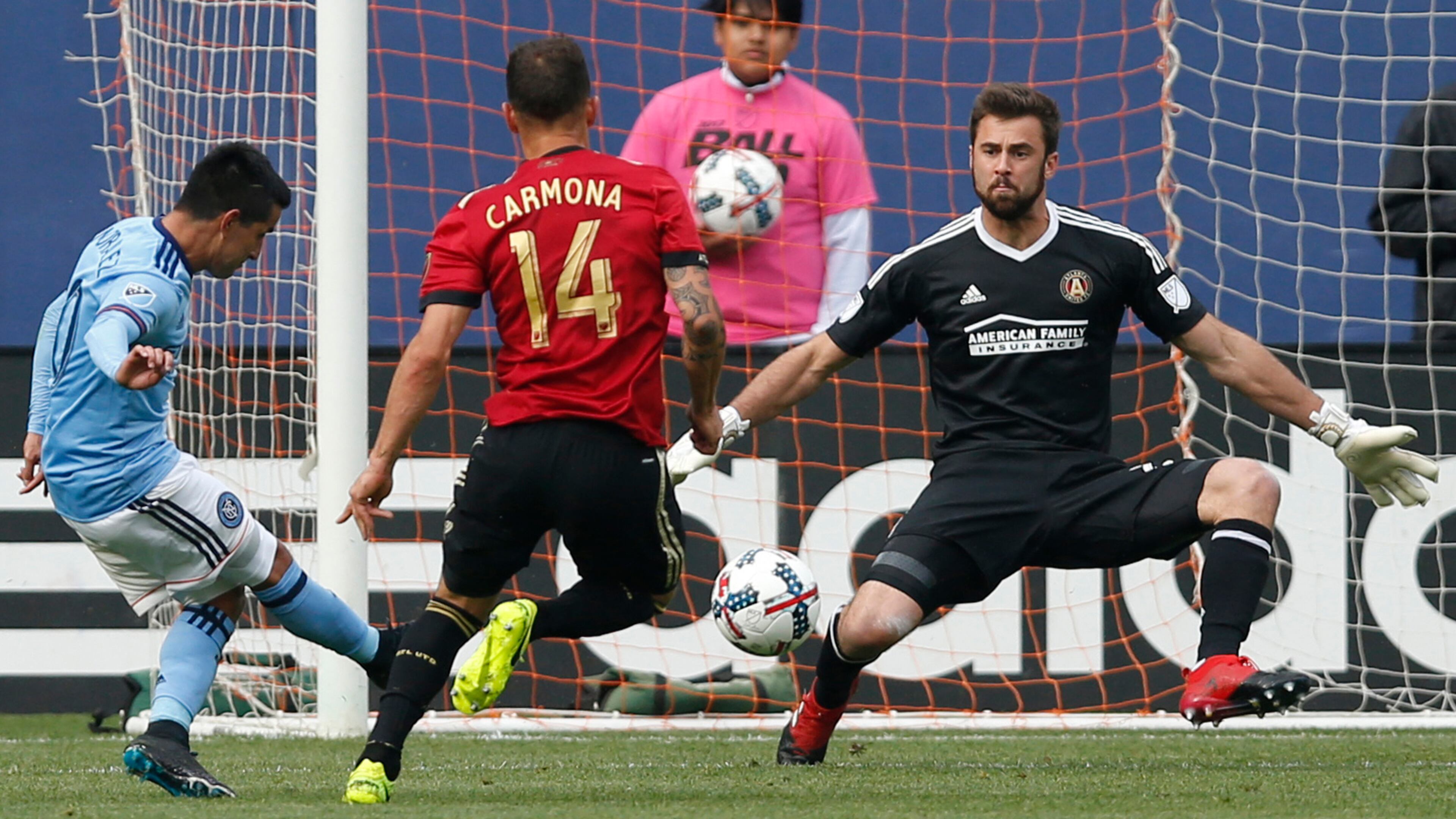 New York City FC midfielder Maximiliano Moralez (10), of Argentina, kicks a goal with Atlanta United midfielder Carlos Carmona (14) defending that goalkeeper Alec Kann (25) failed to stop during the second half Sunday, May 7, 2017, in New York.