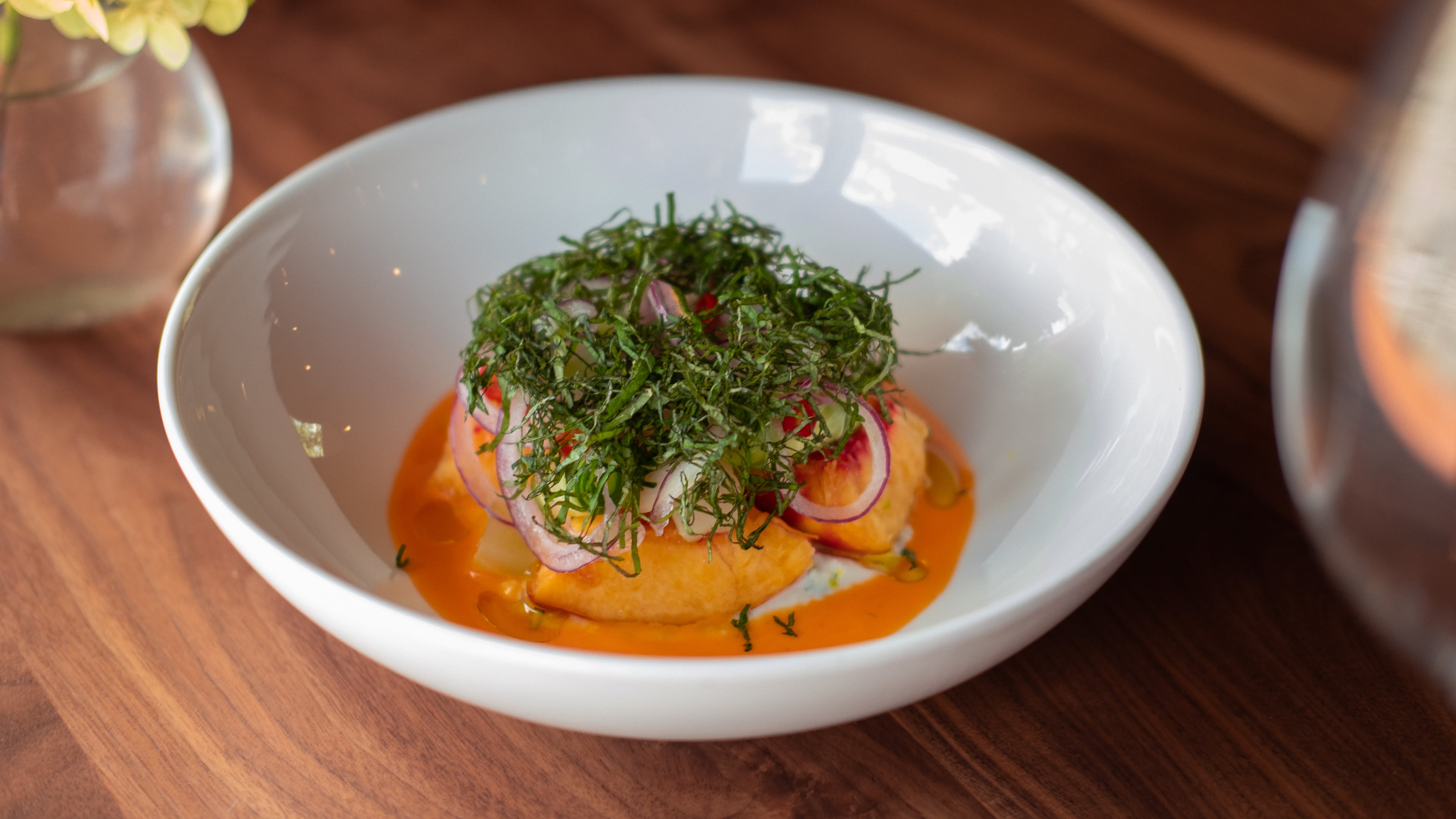 A peach and perilla salad at Spring Marietta (about 15 minutes from Kennesaw State University) is made with Pearson Farm peaches at the height of the summer season. The peppers, cucumbers and red onions are from Straight from the Backyard Farm. (Dashi Dugarzapovic, courtesy of Spring Marietta)