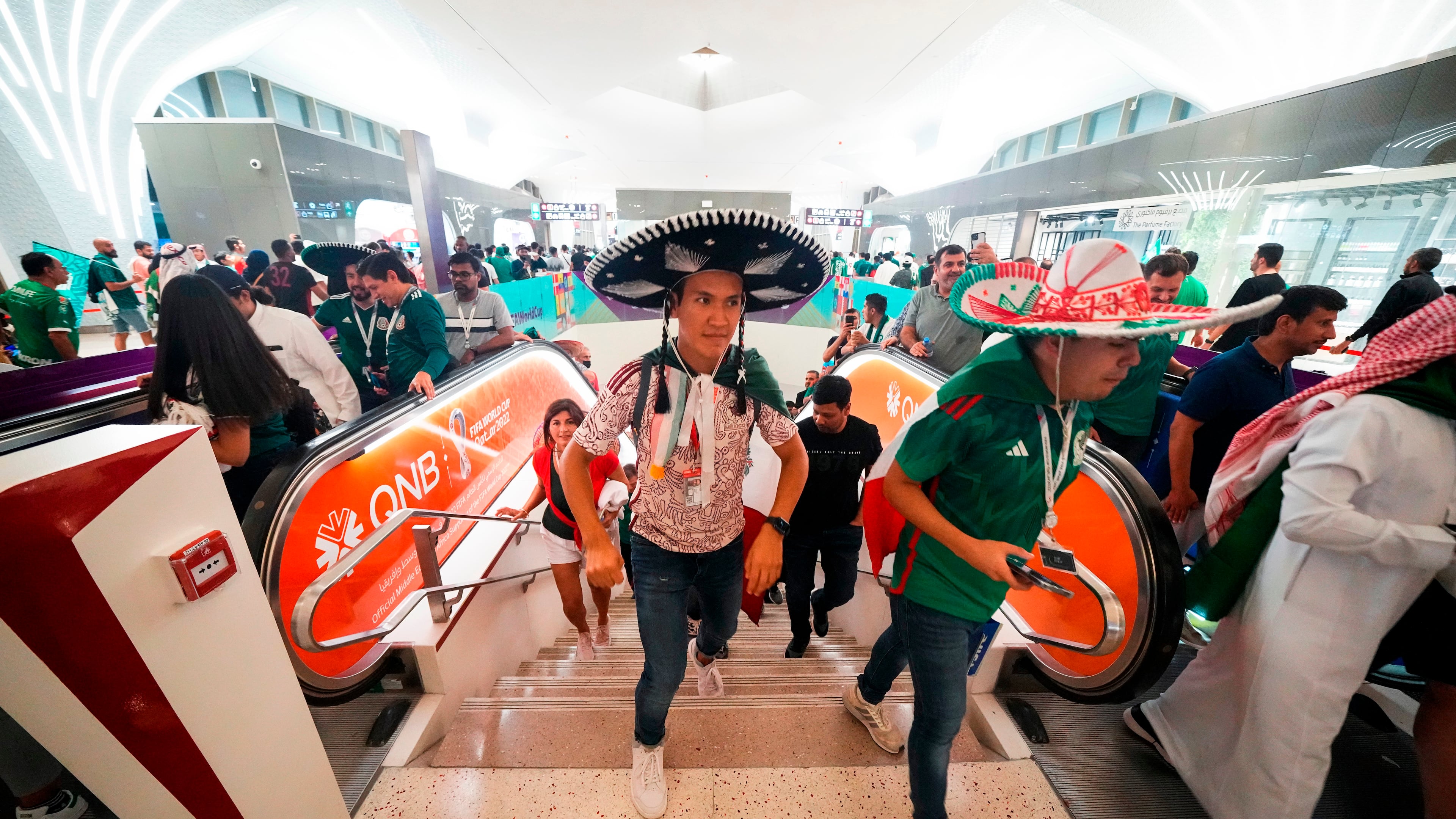FILE - Mexico soccer fans exit the metro station on their way to a World Cup group C soccer match between Saudi Arabia and Mexico, at the Lusail Stadium in Lusail, Qatar, Wednesday, Nov. 30, 2022. (AP Photo/Julio Cortez, File)