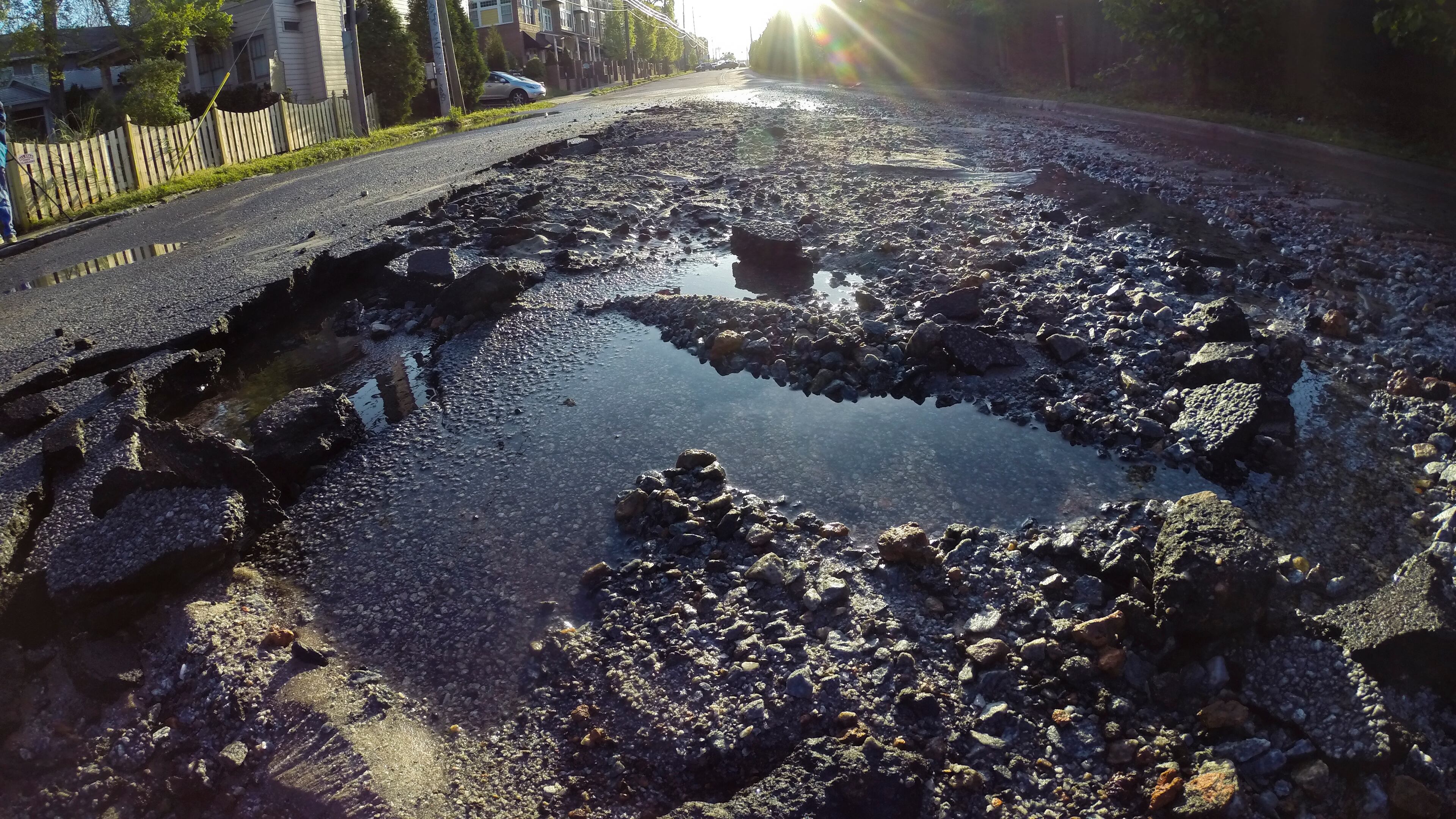 A major northeast Atlanta thoroughfare remained closed just before noon after a predawn water main break flooded the roadway.