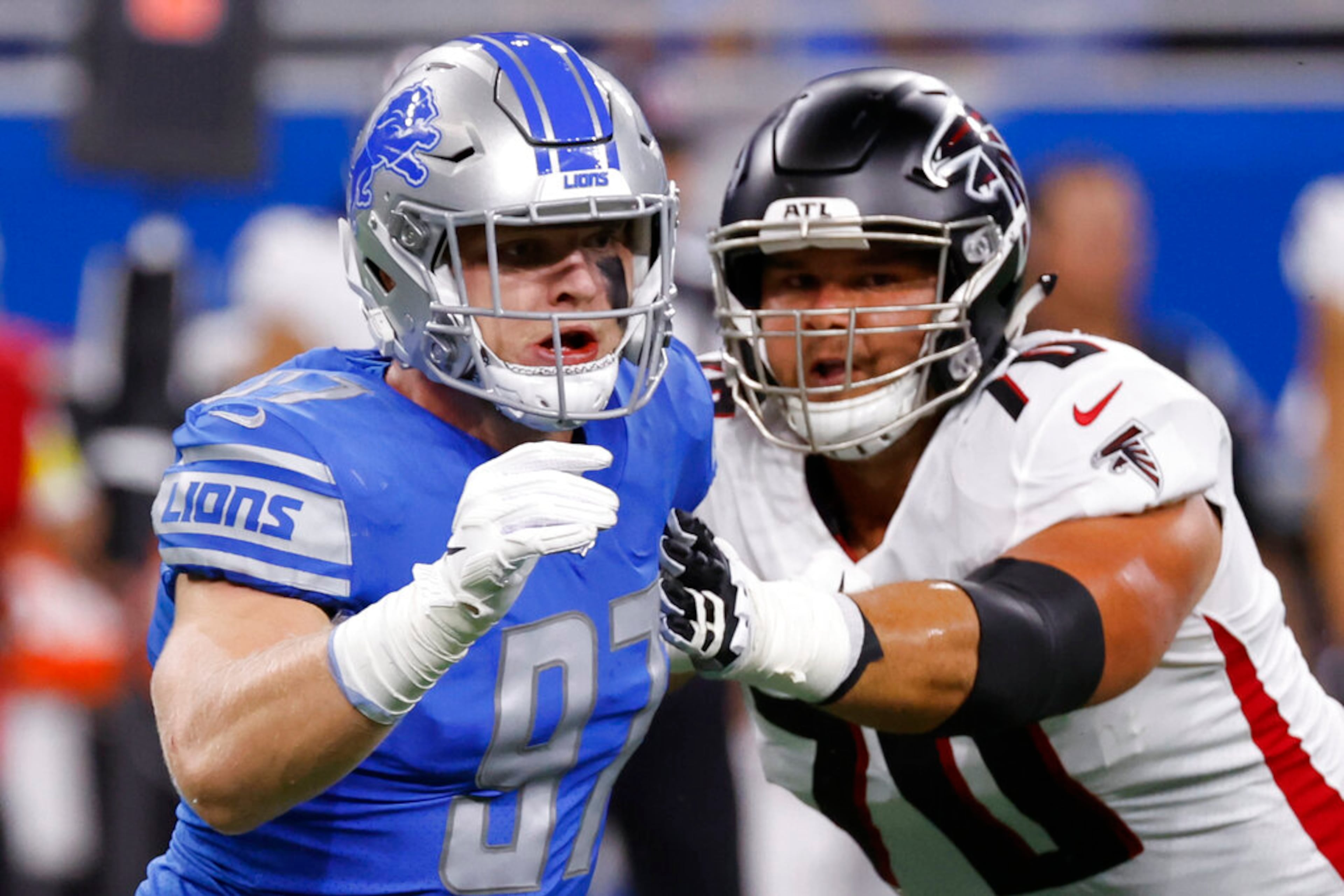 Detroit Lions defensive end Aidan Hutchinson (97) rushes on Atlanta Falcons offensive tackle Jake Matthews (70) in the first half during an NFL football game, Friday, Aug. 12, 2022, in Detroit. (AP Photo/Rick Osentoski)