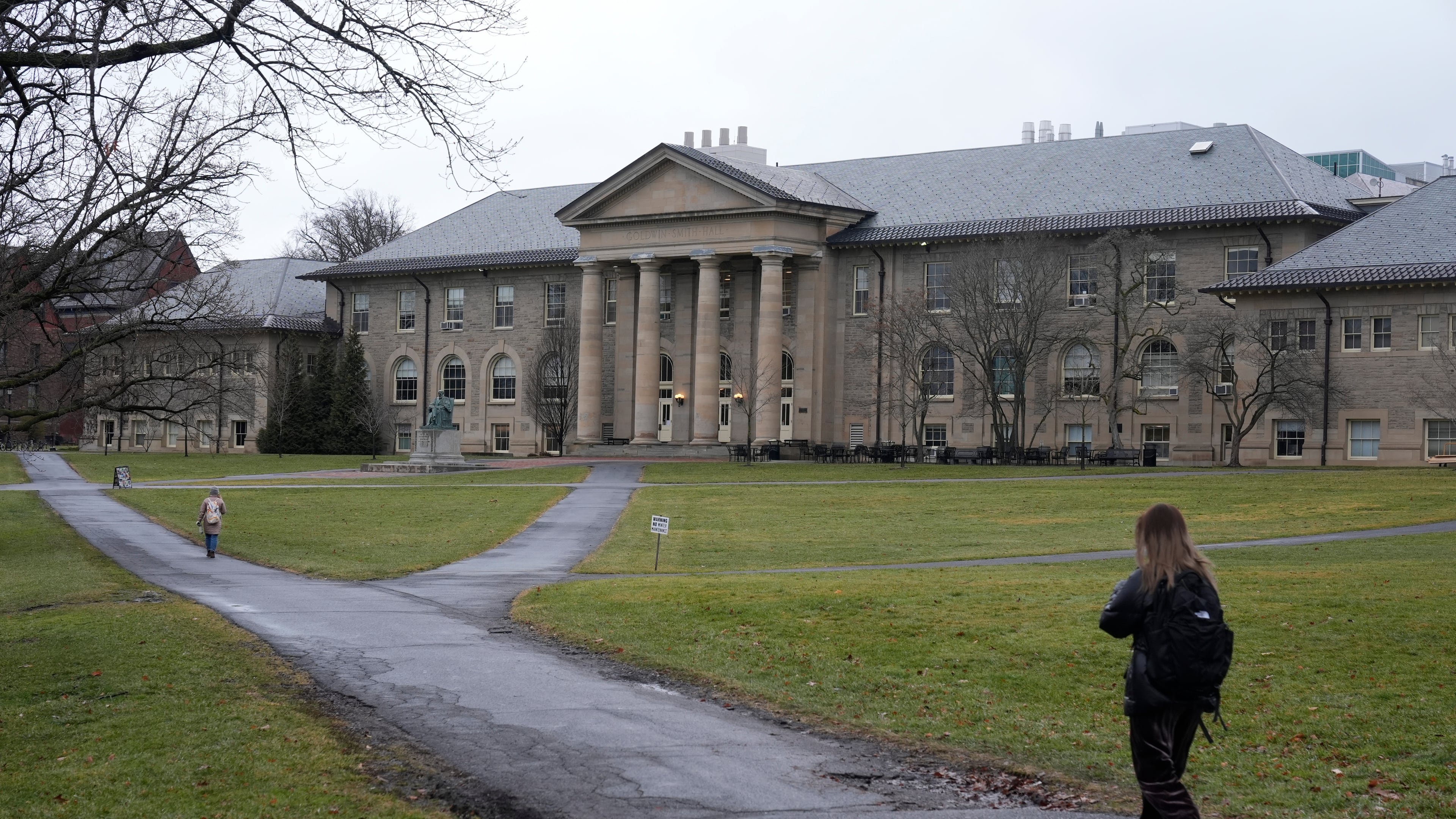 FILE - People walk on the campus of Cornell University in Ithaca, N.Y., Friday, Feb. 2, 2024. (AP Photo/Seth Wenig, file)