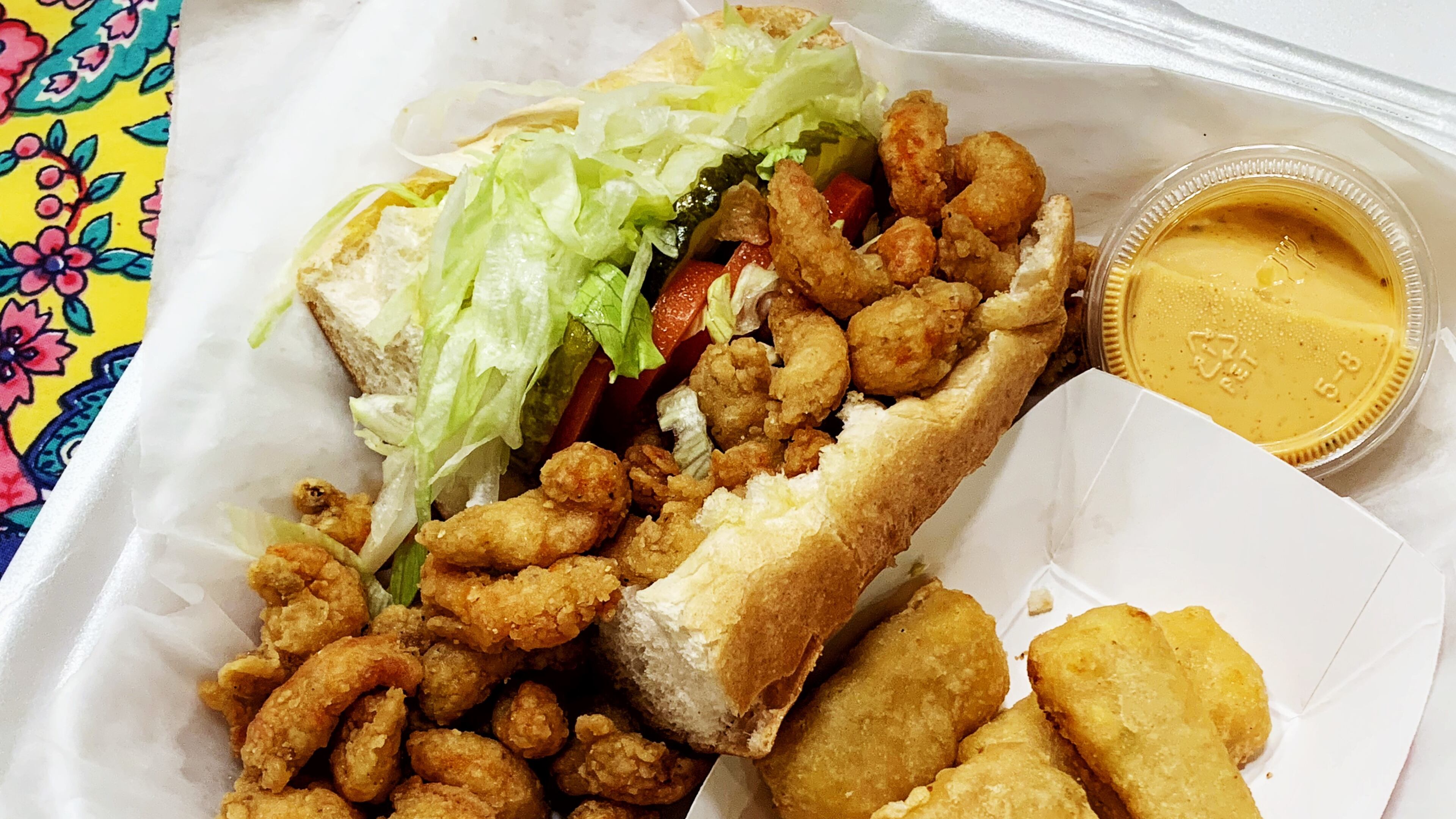 The crawfish po'boy from Crawfish Shack features crawfish chunks that are plump and juicy, with a well-balanced meat-to-breading ratio. Henri Hollis for The Atlanta Journal-Constitution.