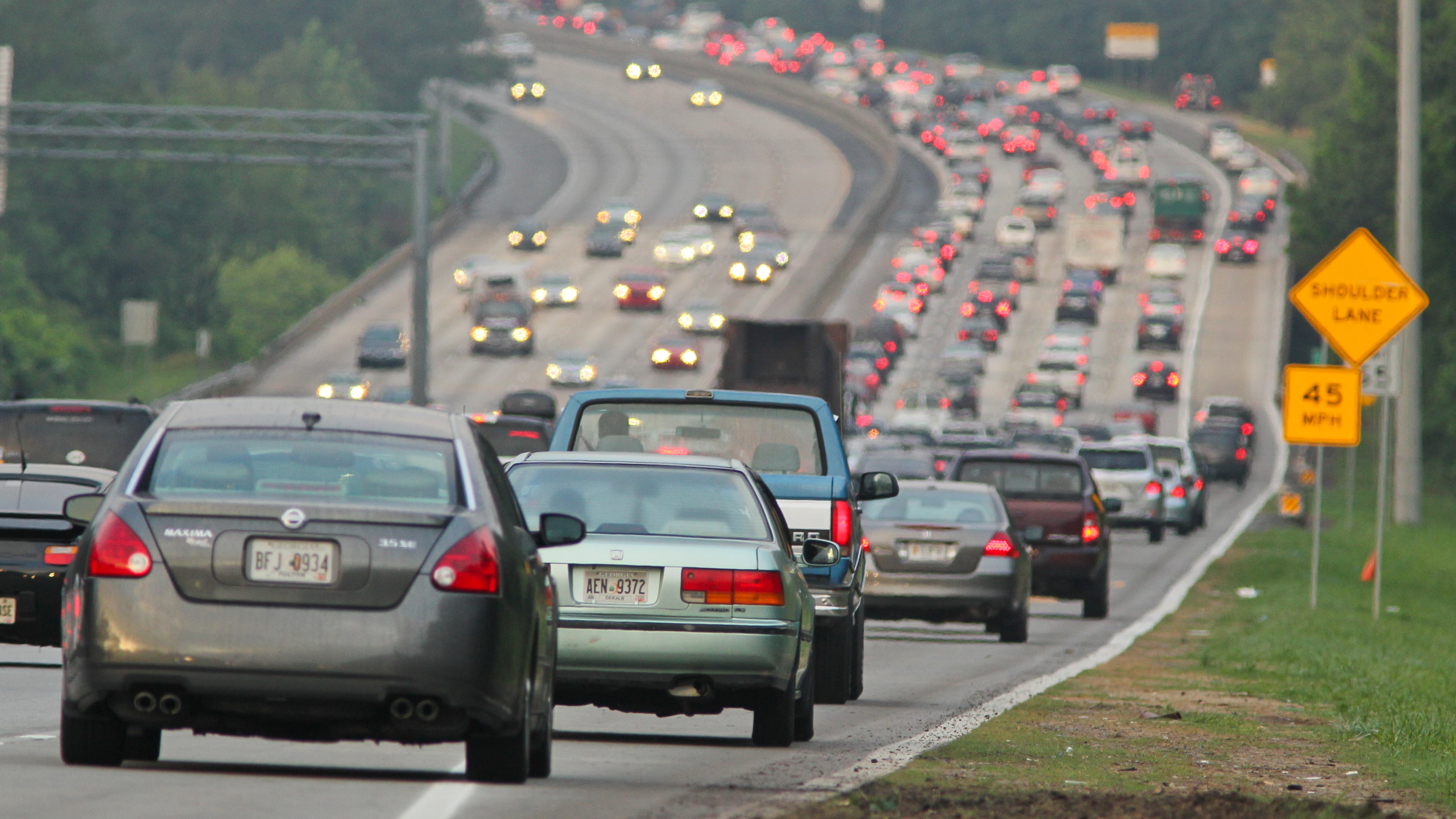 Cars begin to enter the shoulder on southbound Ga. 400 at Holcomb Bridge Road on May 14, 2012.